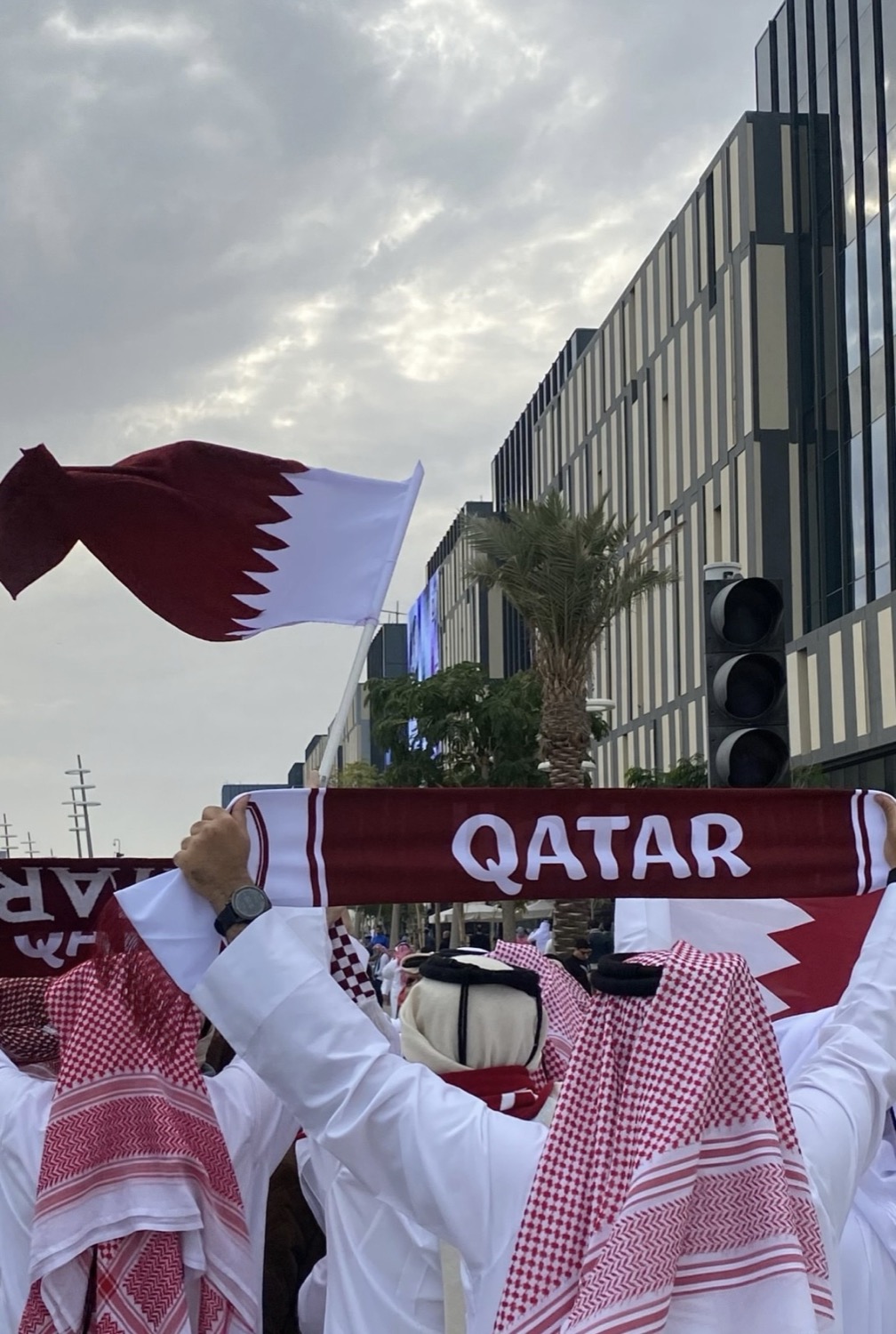 A Qatar scarf raised on the way to the stadium, Lusail