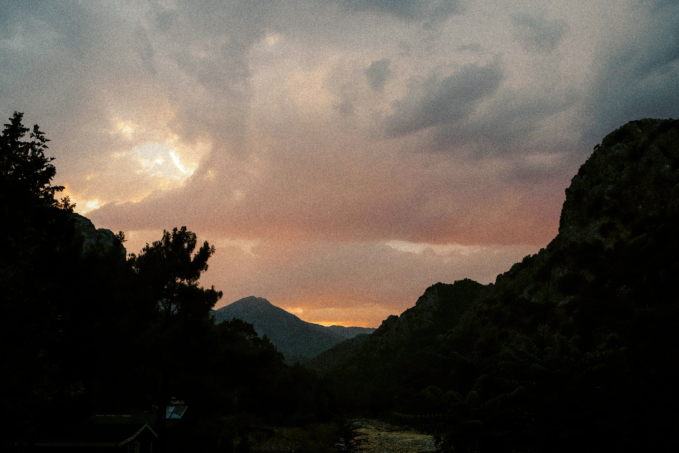 Cloud and the last of the light over a valley