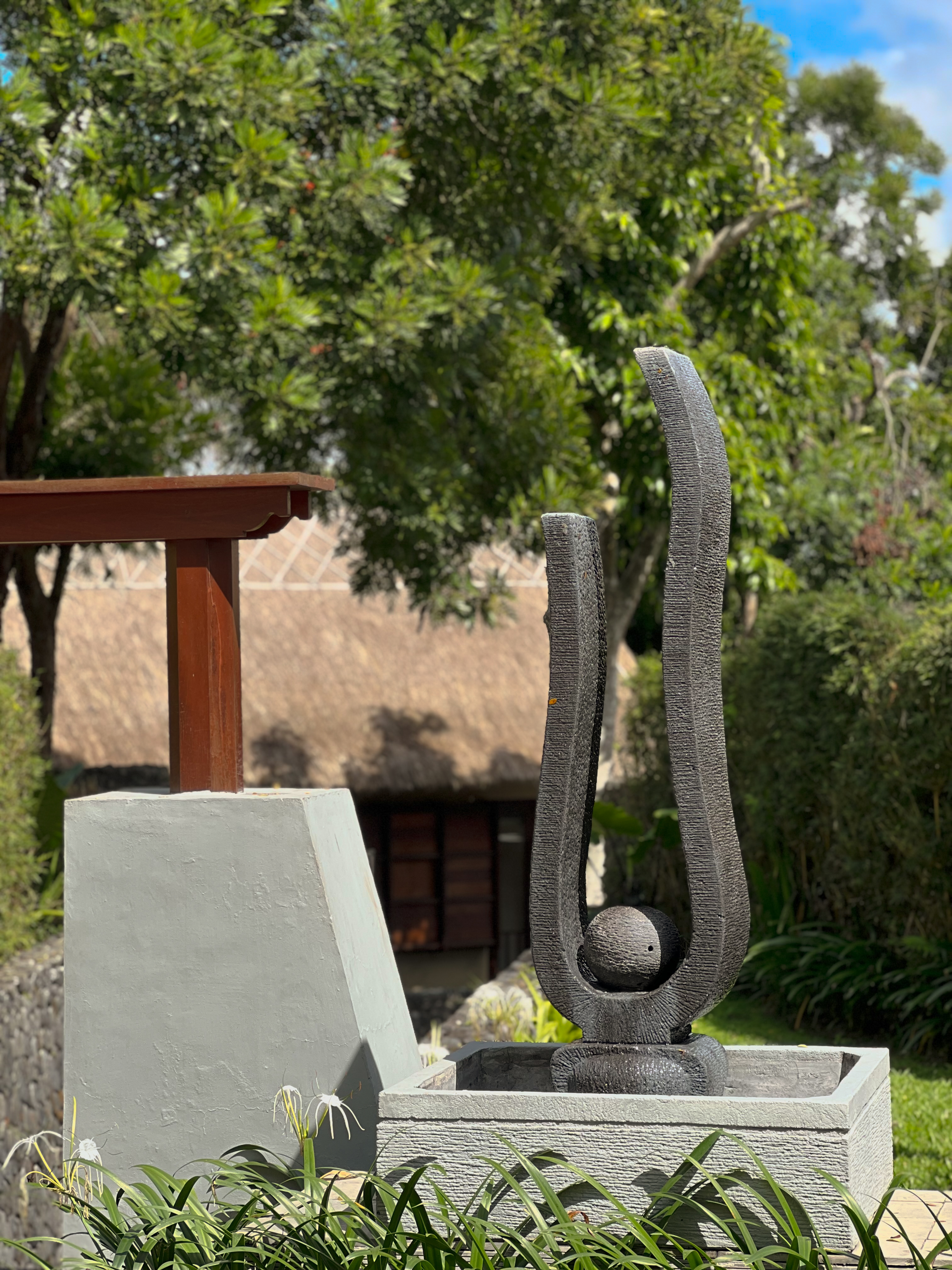 Volcanic stone sculpture in the garden, Alila Ubud