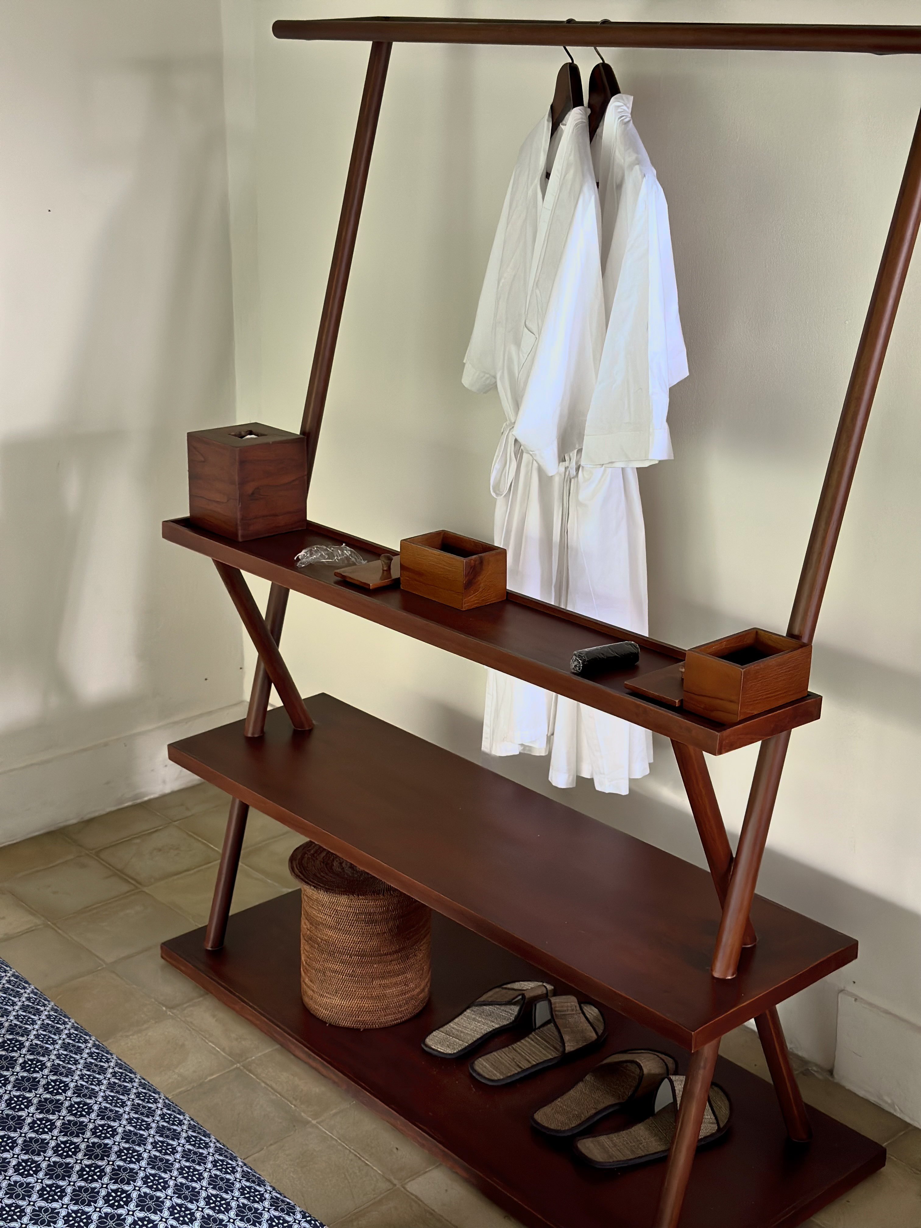 Timber wardrobe rack, white robes, rattan and slippers, Alila Ubud