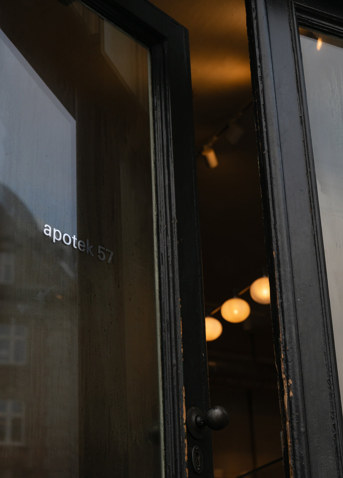 A door left open, Apotek 57 cafe interior, Copenhagen