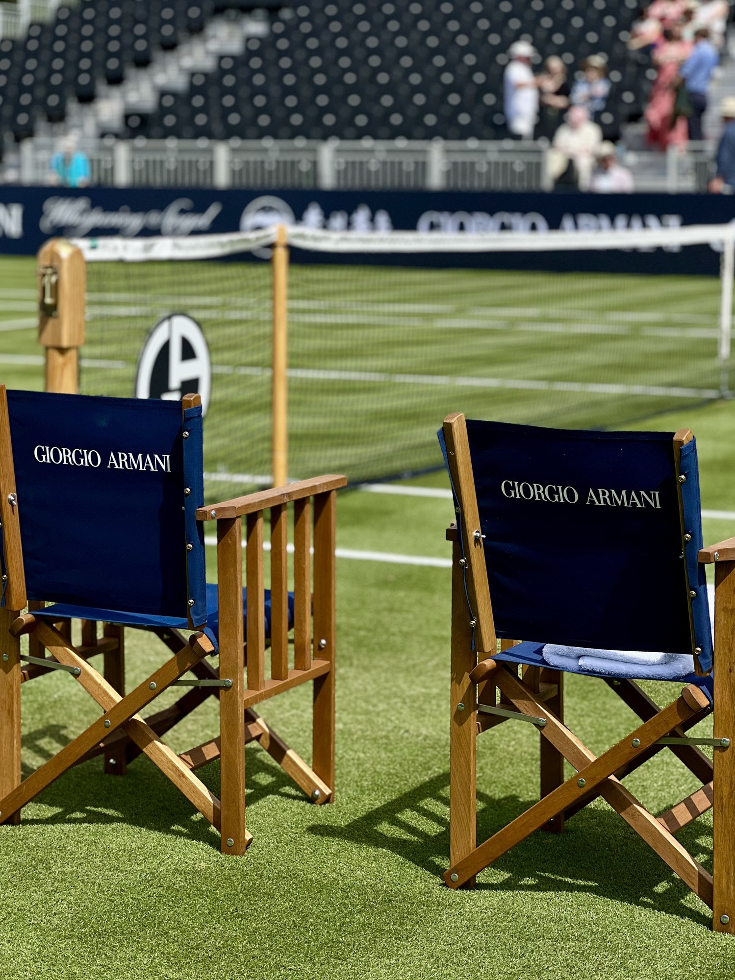 Empty chairs courtside, Giorgio Armani Tennis Classic, Hurlingham Club, London