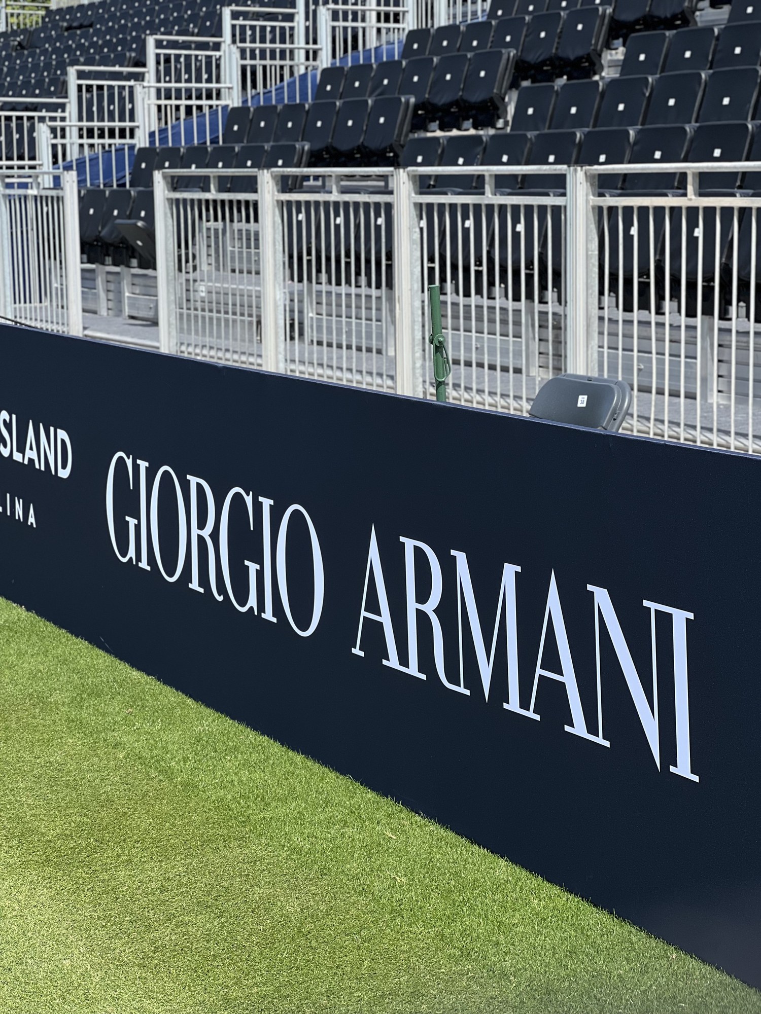 Branding along the empty stands, Giorgio Armani Tennis Classic, Hurlingham Club, London