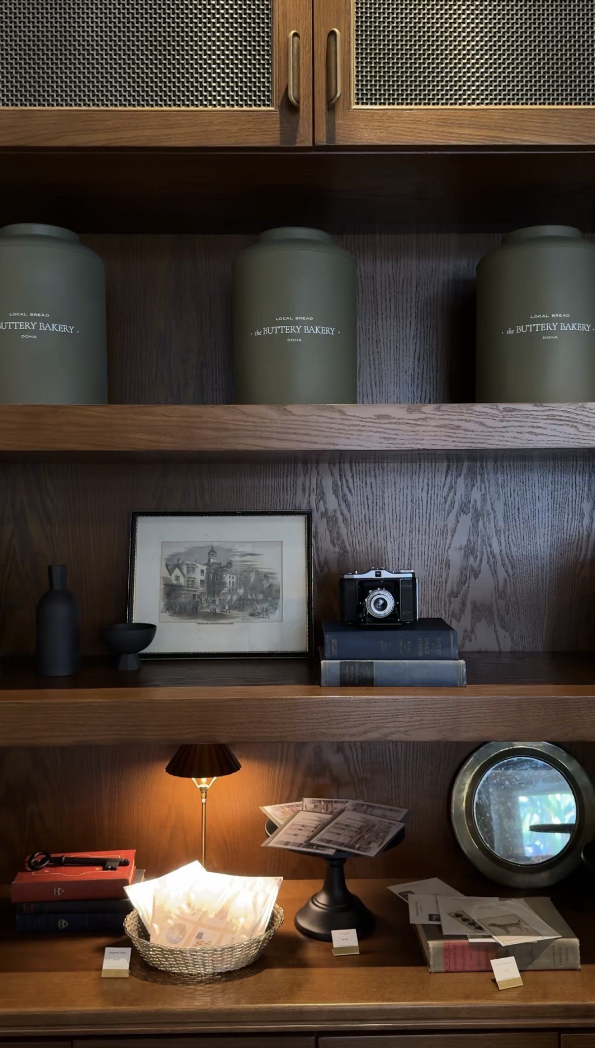Shelving and storage canisters in repetition, The Buttery Bakery, Doha