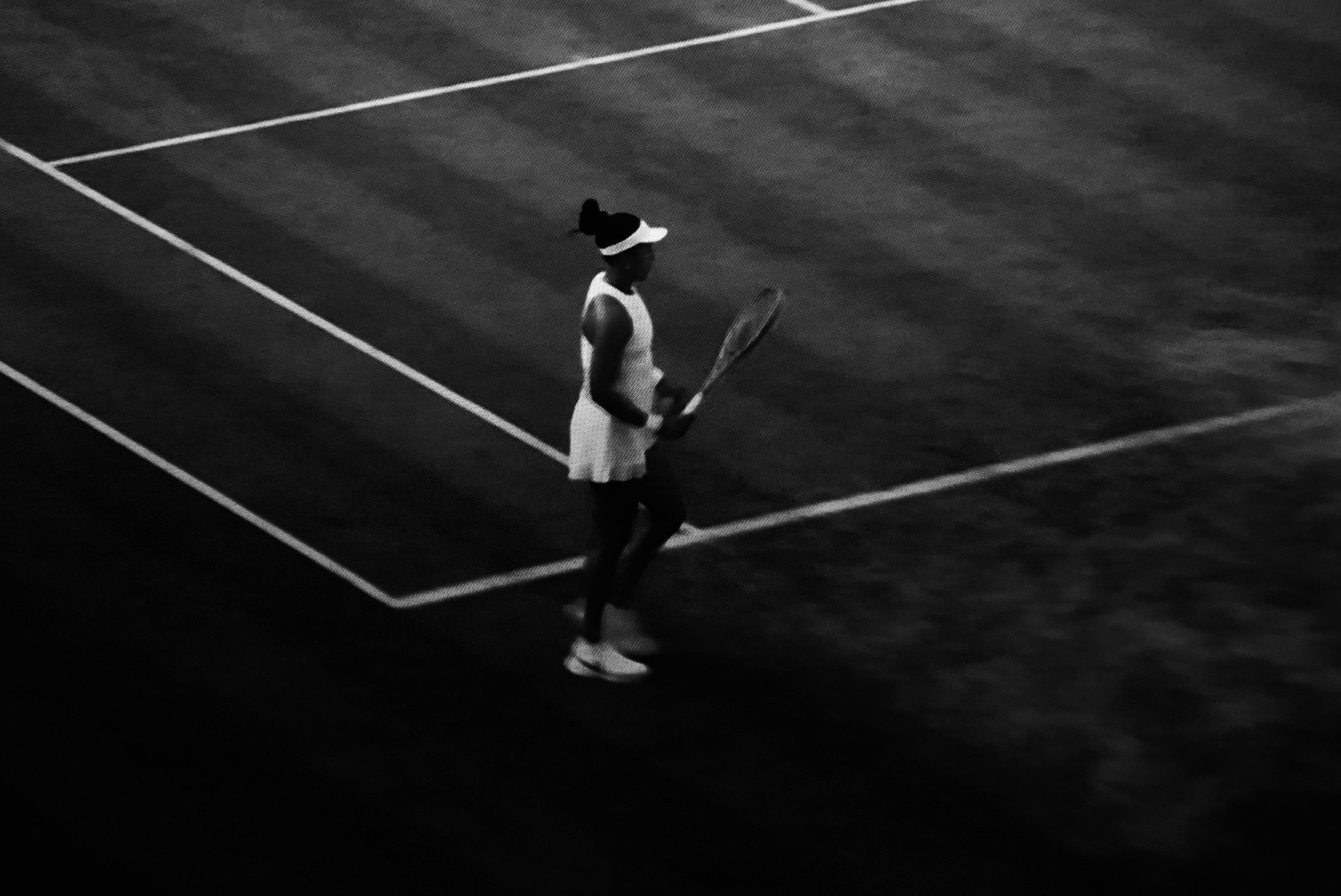 A figure crossing the court alone between points