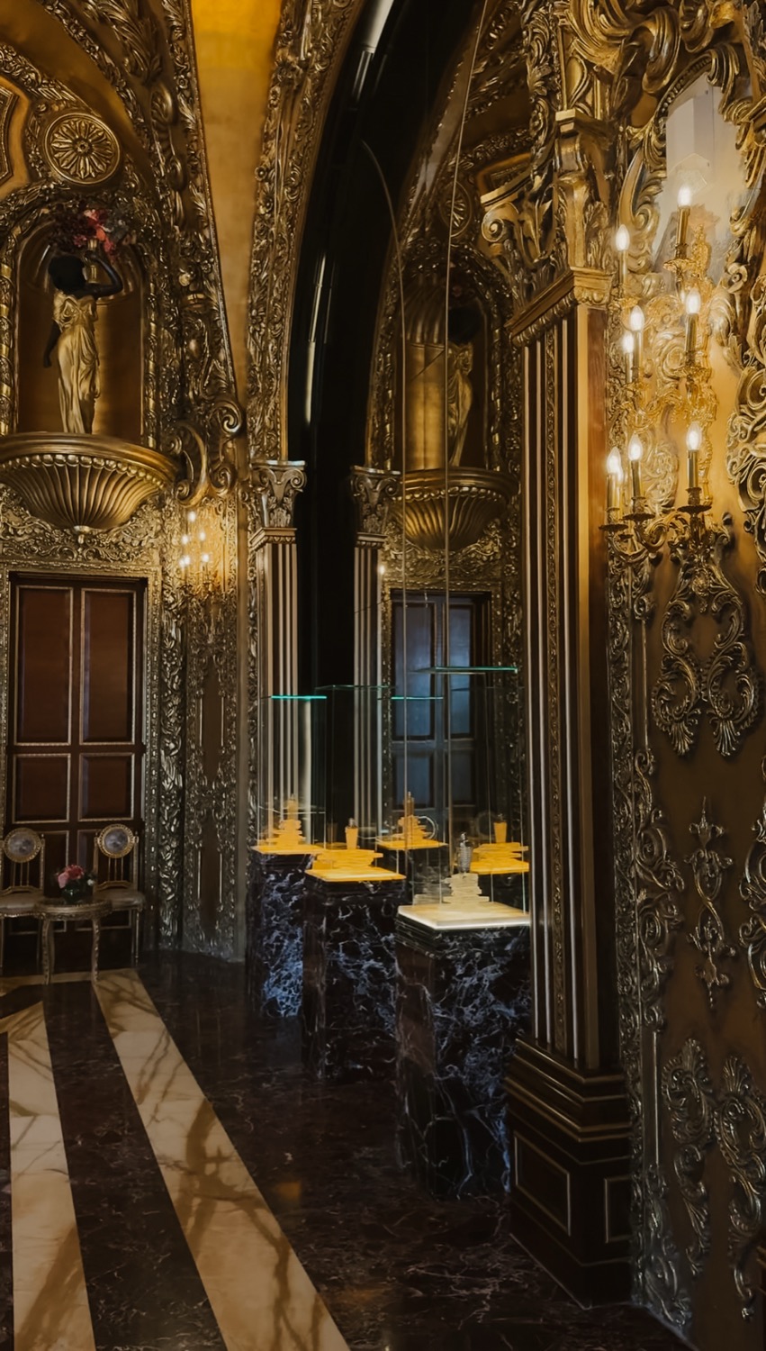The colonnade of glass cases and marble pedestals, Dar Al Teeb, Al Hazm Mall, Doha