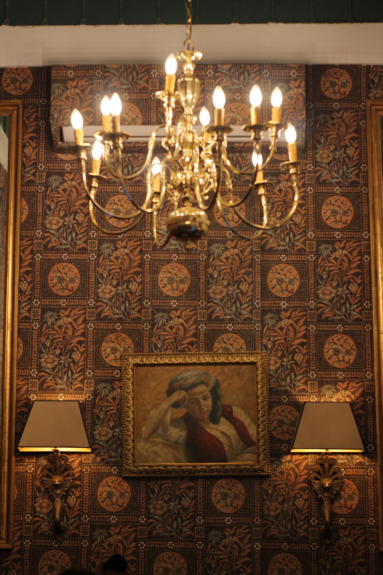 Chandelier against patterned walls, Dar El Bacha palace, Marrakech, Morocco