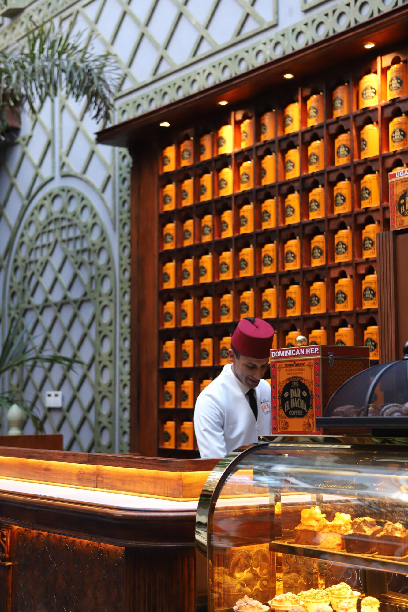 The counter and the wall of tins, Dar El Bacha palace, Marrakech, Morocco