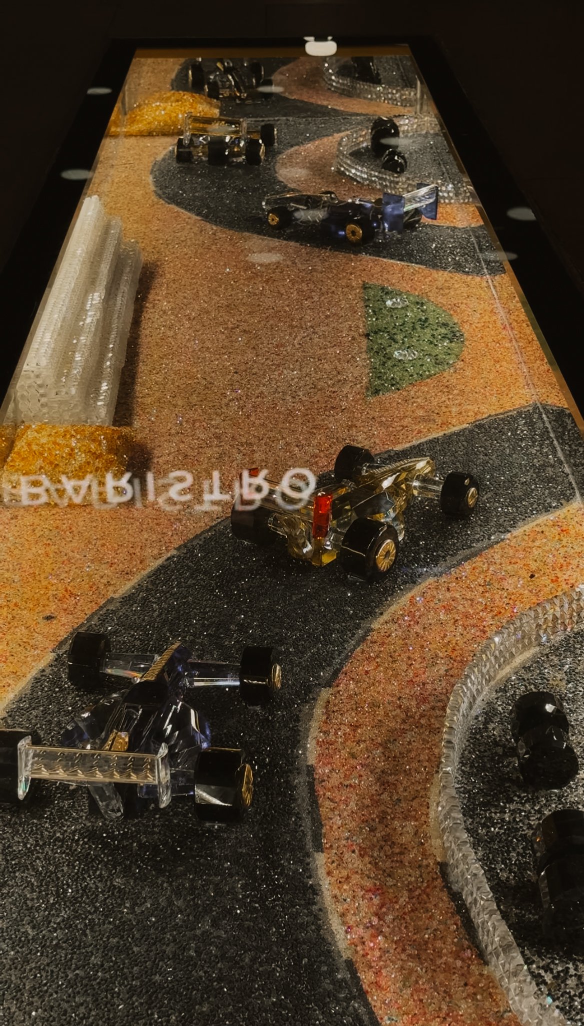 A mosaic tabletop laid as a racing circuit, Gewan Island, Doha