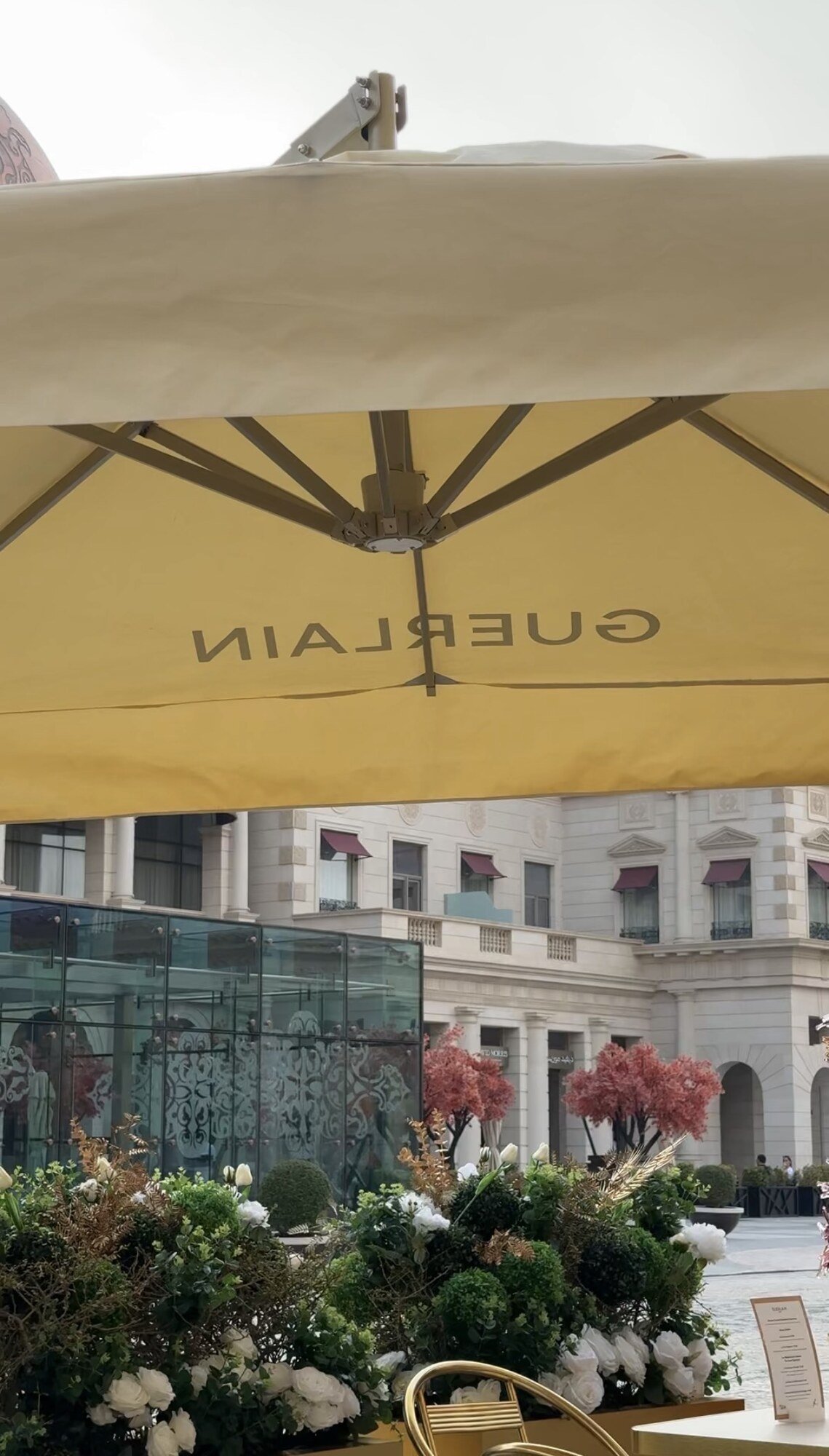 Beneath the umbrella, Guerlain boutique, Katara, Doha
