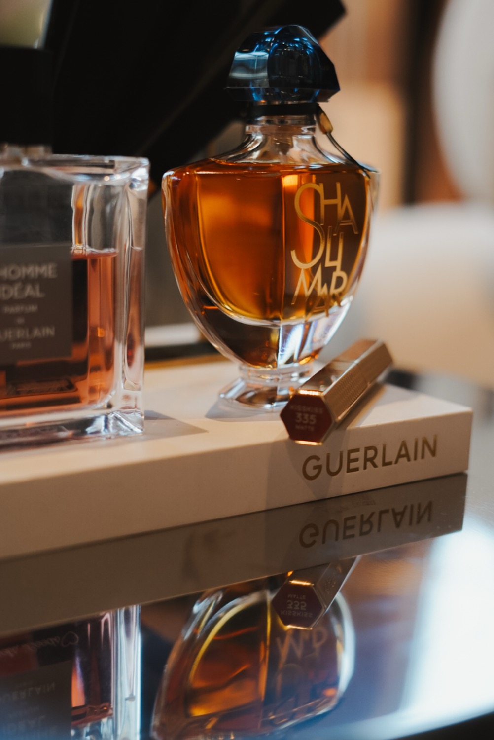 Shalimar Souffle bottle and KissKiss lipstick on a Guerlain plinth, Leeds