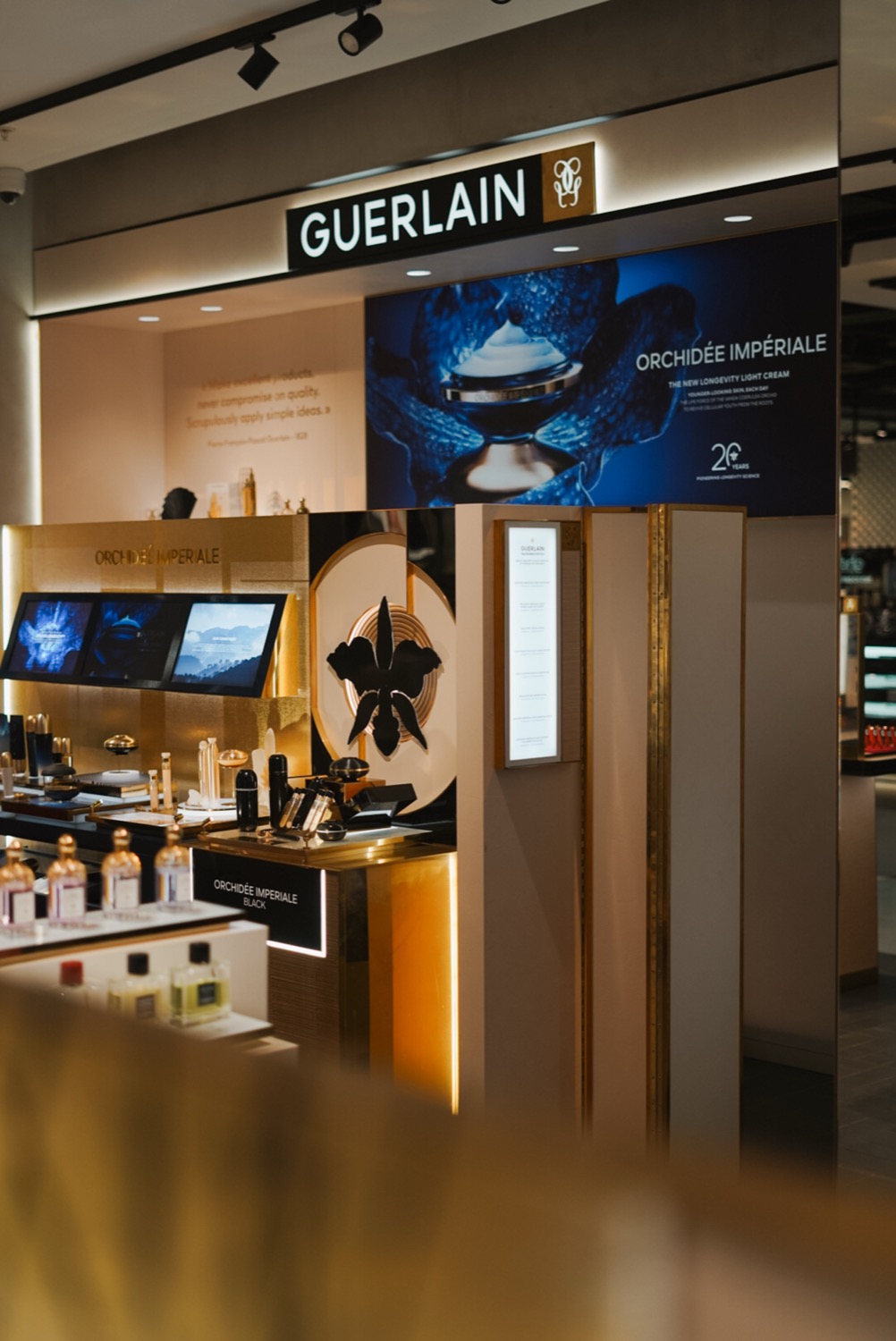 Guerlain counter with Orchidée Impériale display and signage, Leeds
