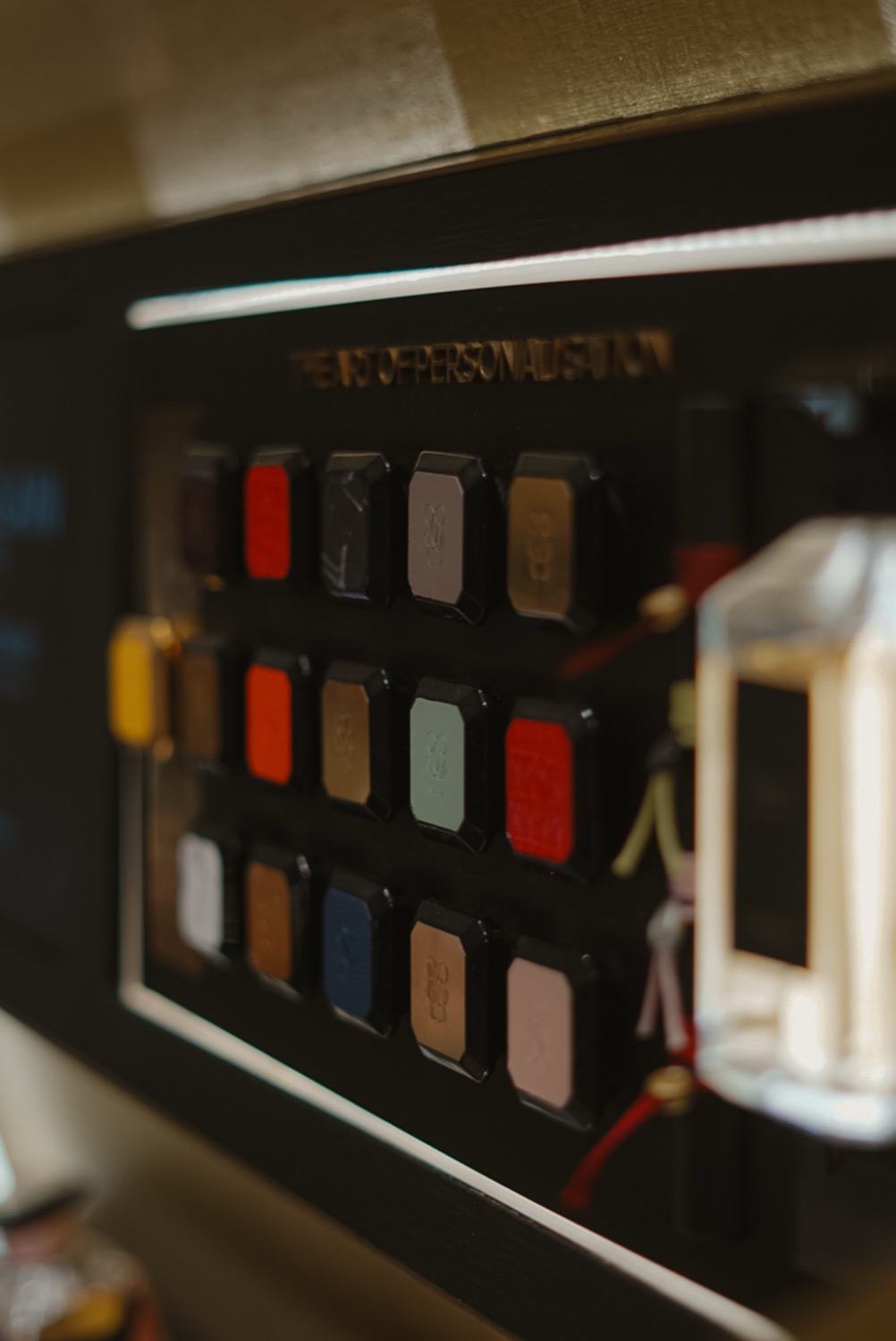 Panel of coloured lipstick cases under the art of personalisation, Guerlain, Leeds