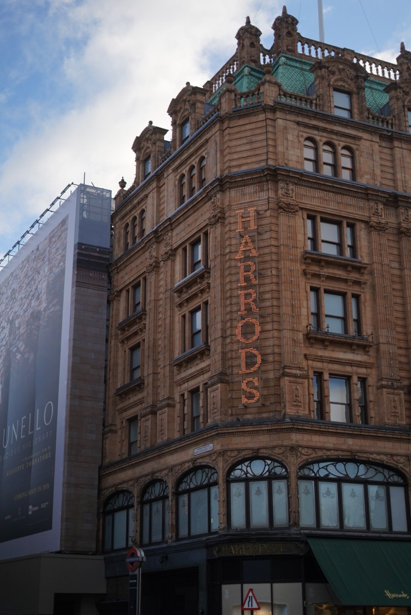 Harrods façade with lit signage, Knightsbridge, London
