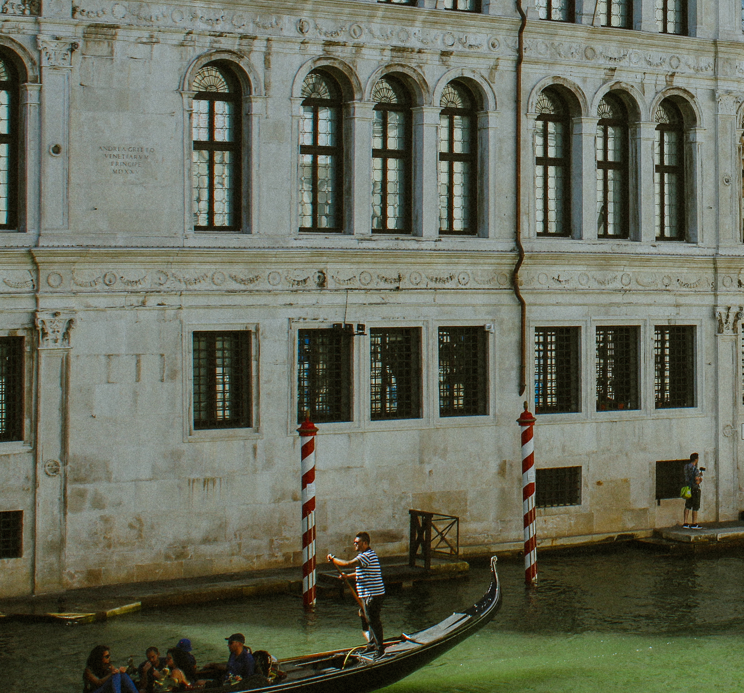 Gondolier on the Grand Canal, Venice palazzo facade