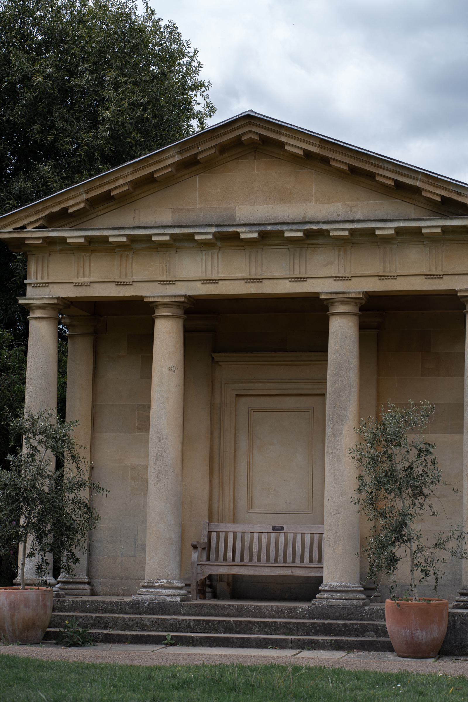 Classical garden portico in still light, Royal Botanic Gardens, Kew