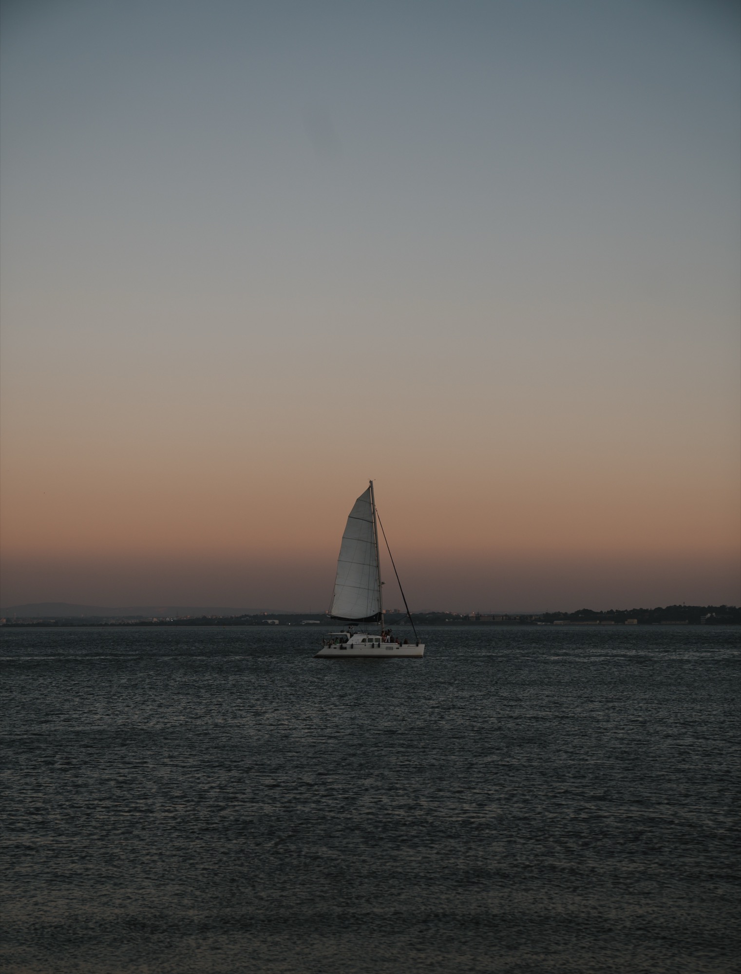 Sailboat at dusk on the Tagus, Lisbon