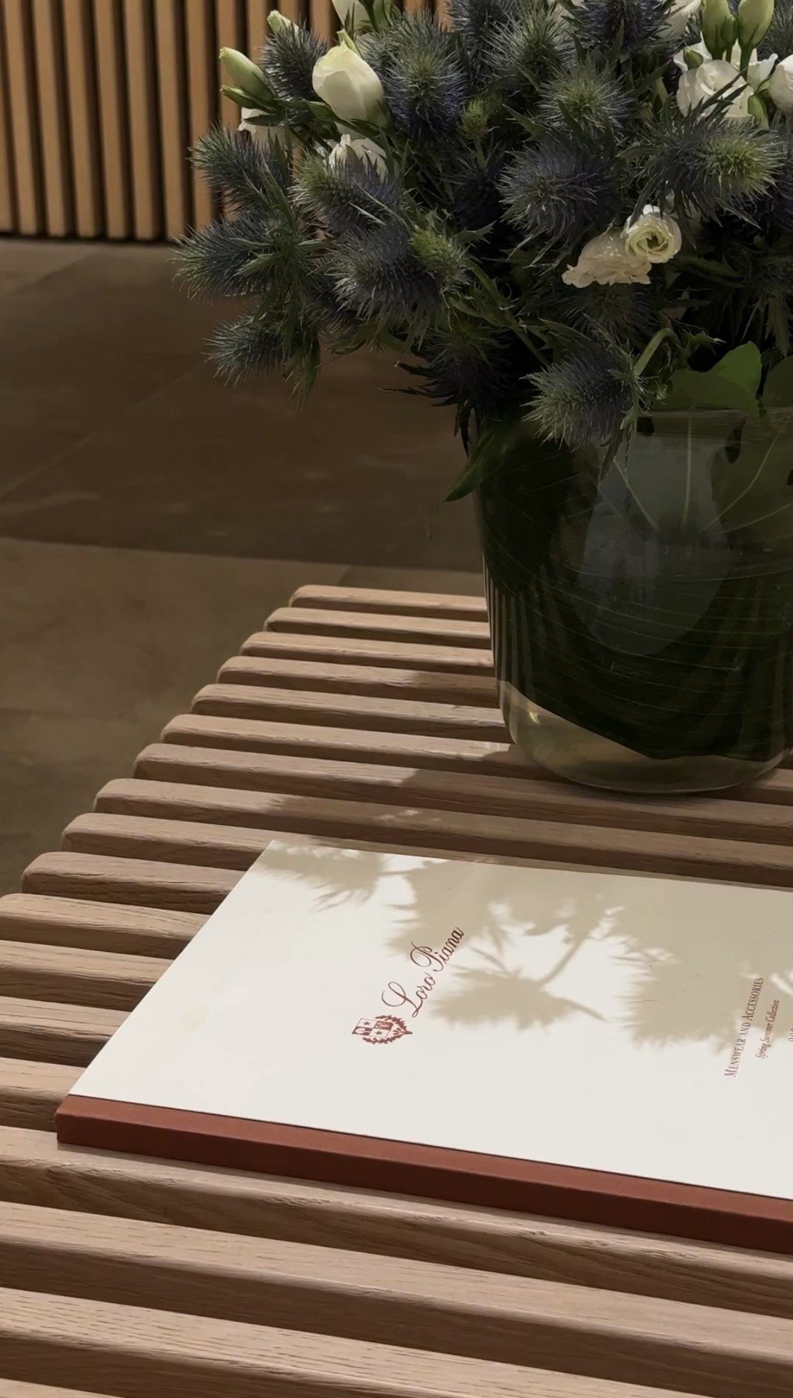 Flowers beside the menu, Loro Piana boutique, Milan