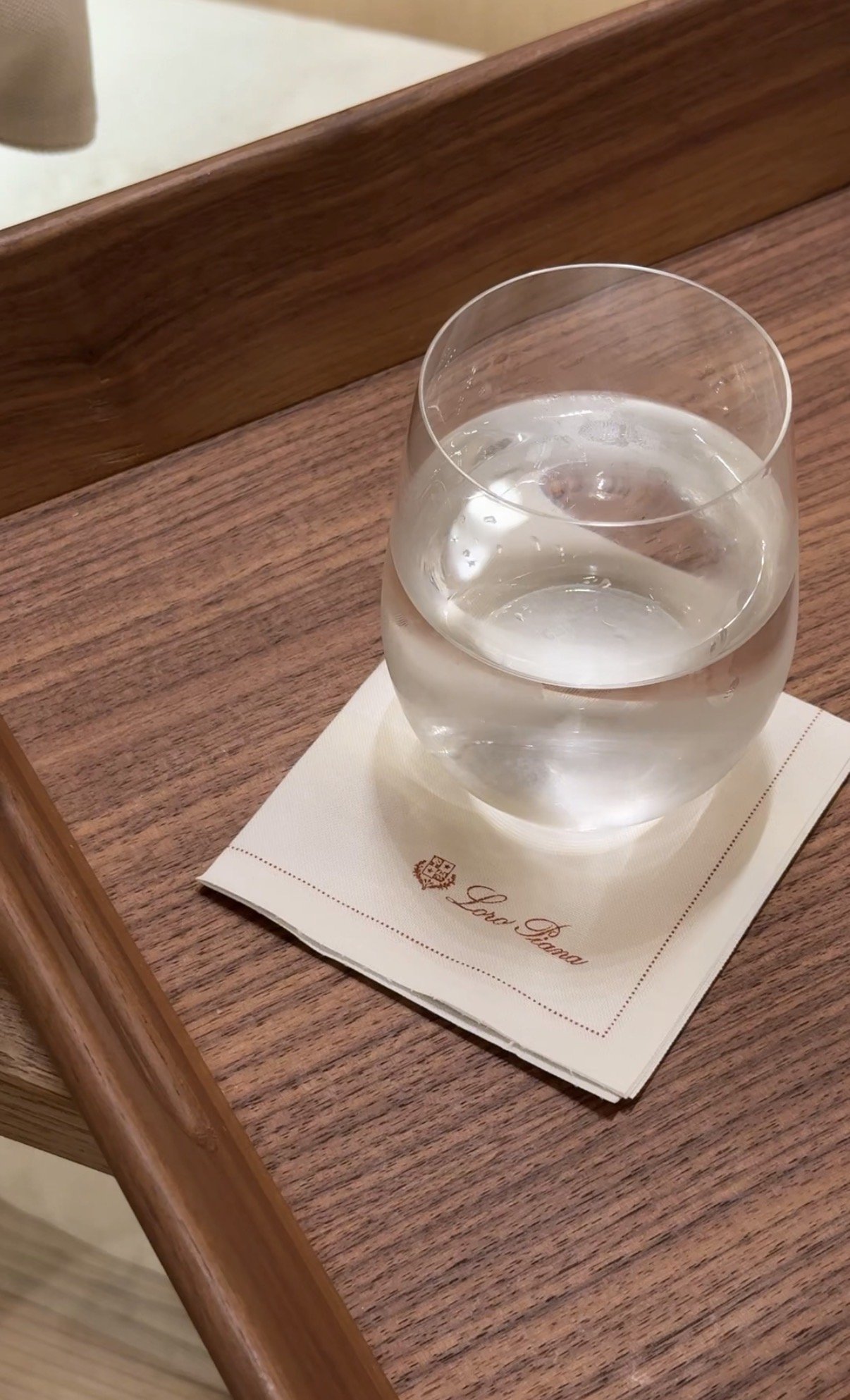 A glass of water on the tray, Loro Piana boutique, Milan
