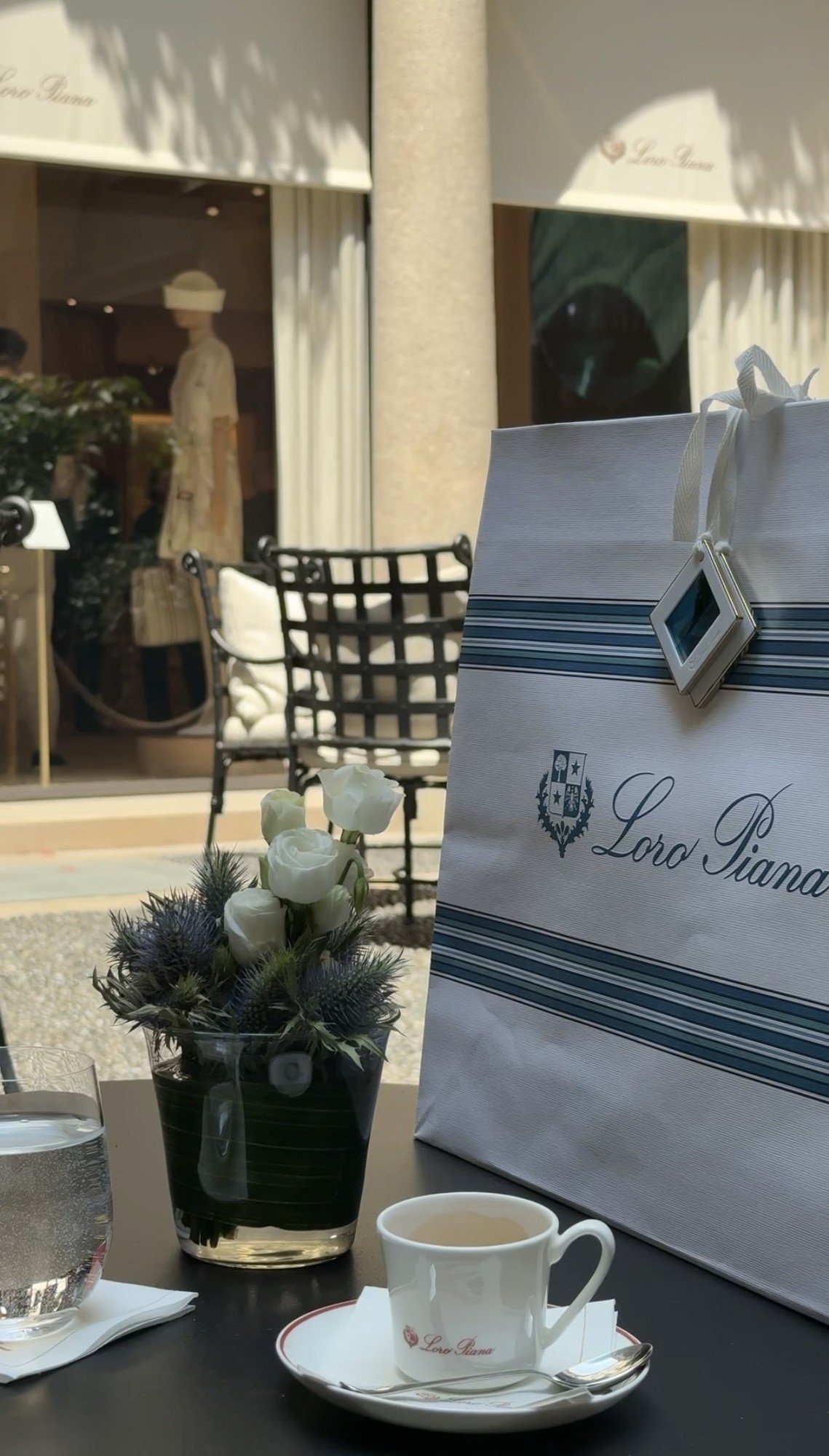 The bag at the table, Loro Piana boutique, Milan