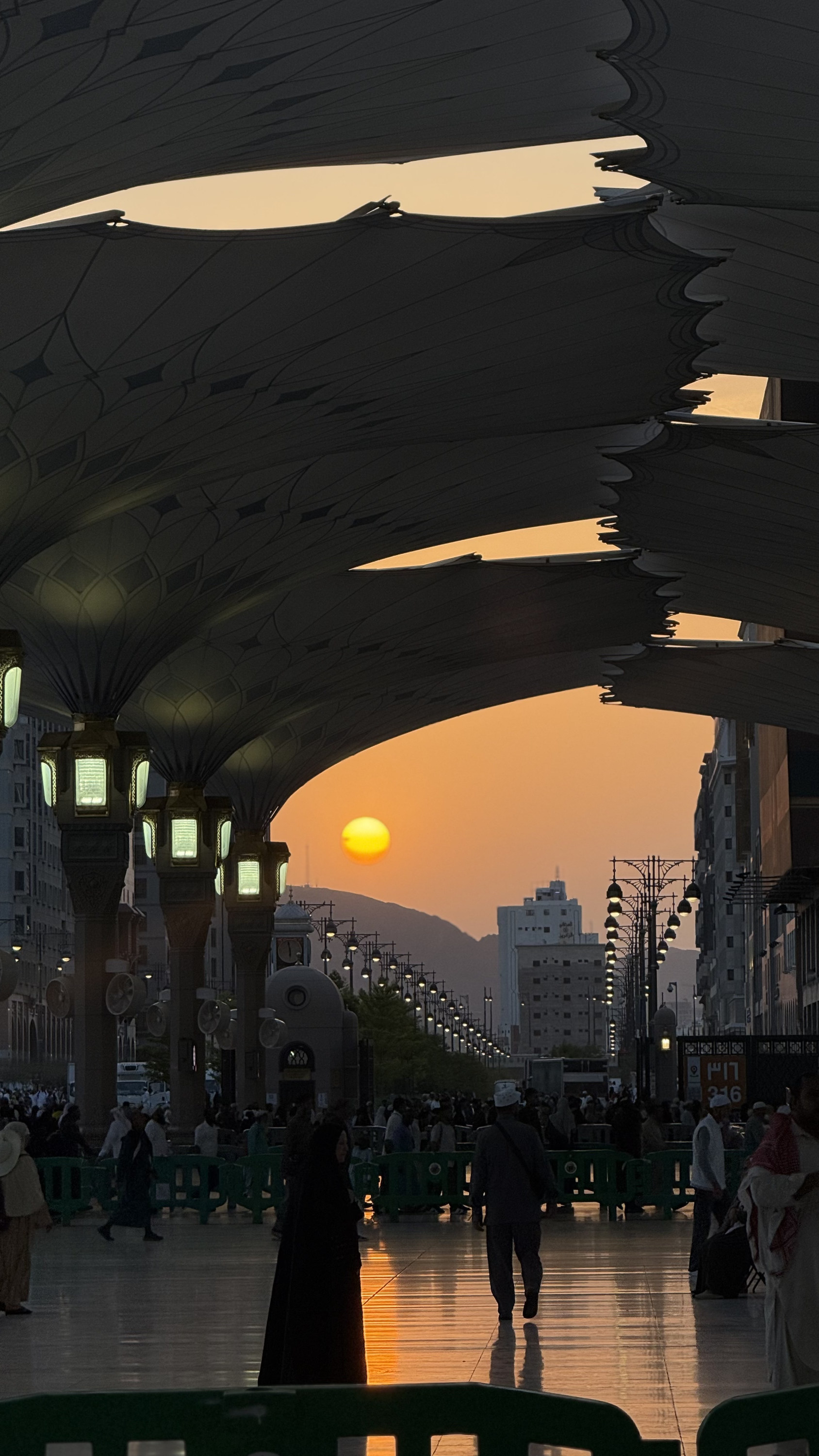 Sunset beneath the mosque umbrellas with colonnade, Madinah al-Munawwarah