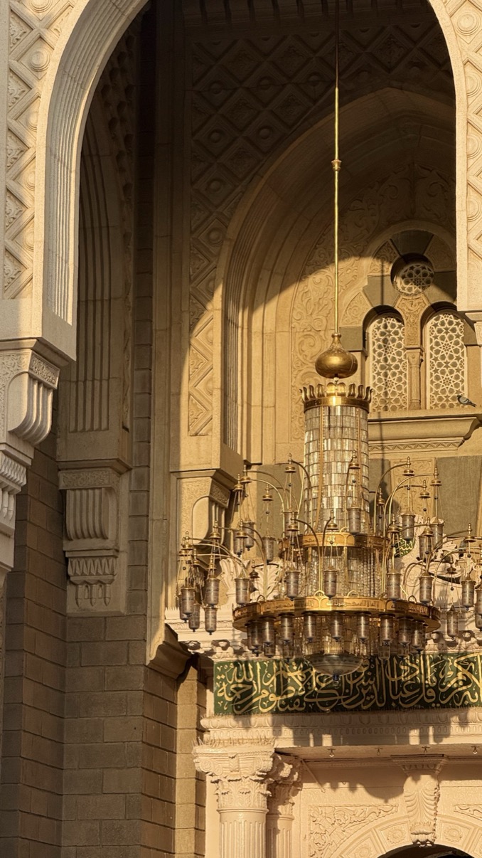 Chandelier in warm golden arch light, Al-Masjid an-Nabawi, Madinah al-Munawwarah