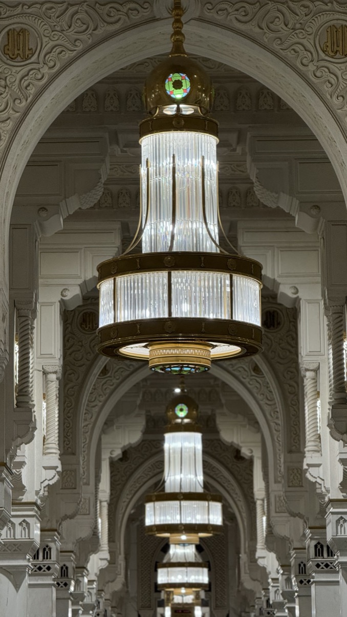 Chandeliers inside the Grand Mosque corridor with arches, Makkah al-Mukarramah