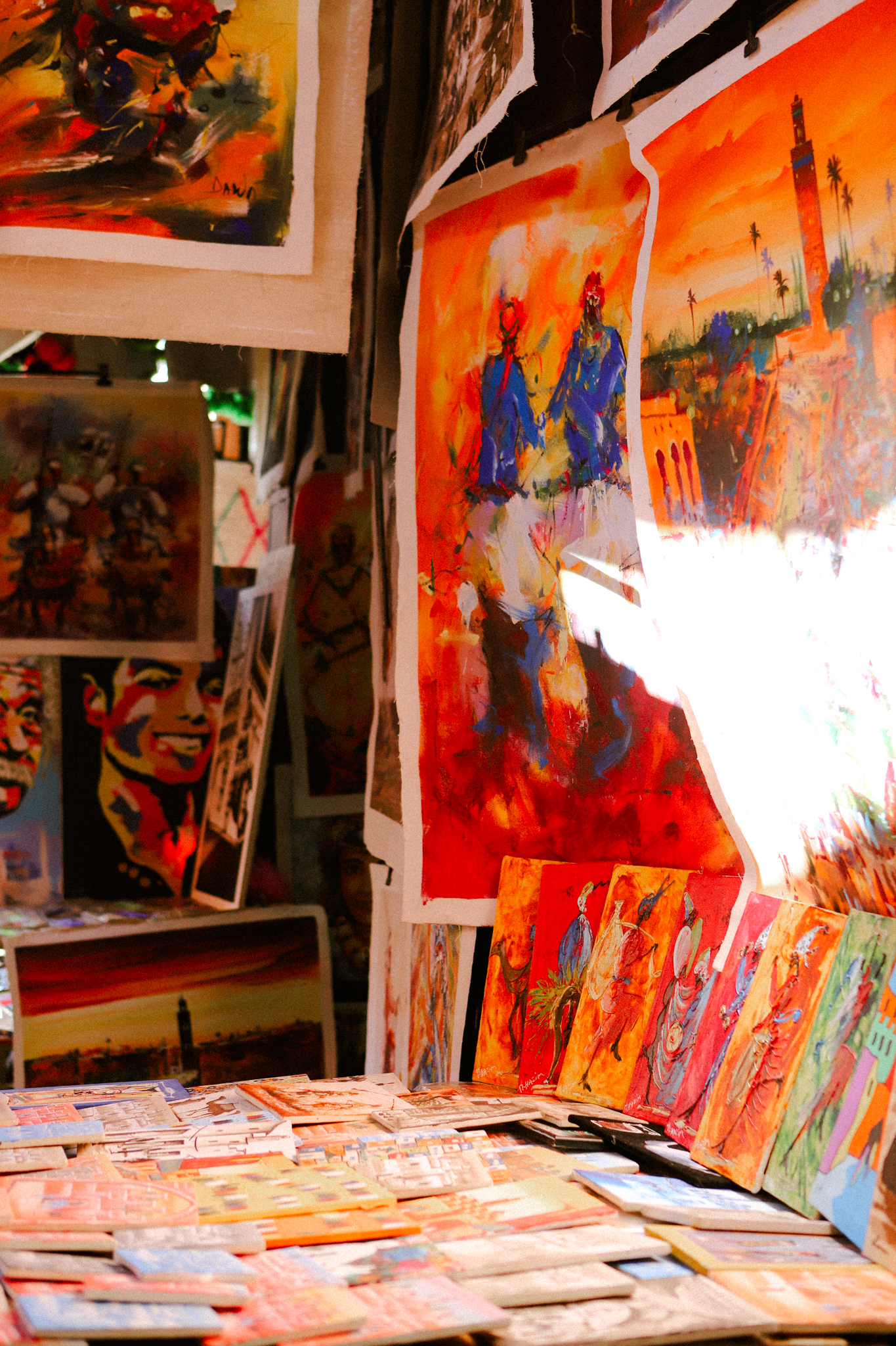 Painted canvases stacked in a stall, Marrakech