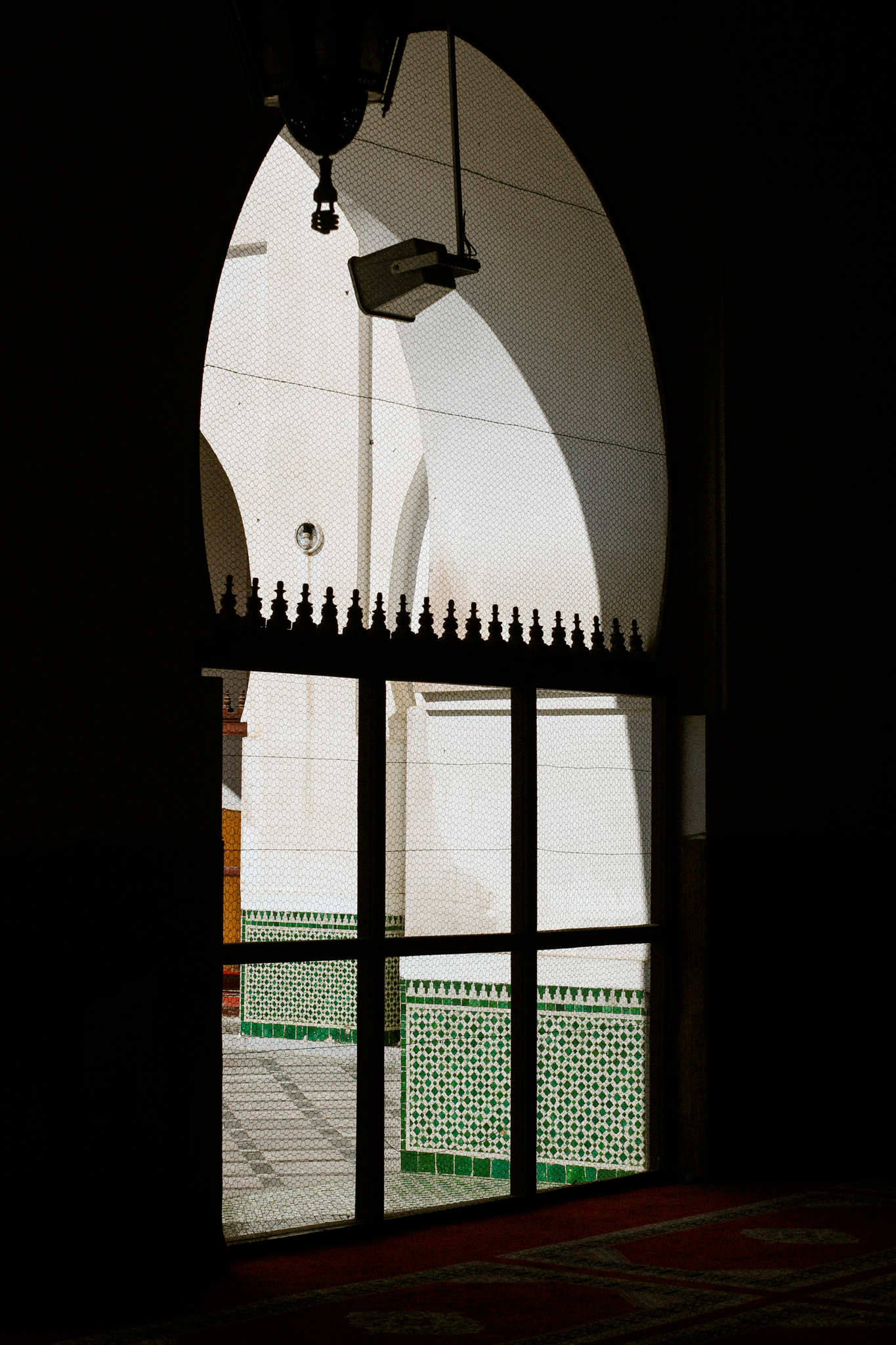 A mosque window onto a tiled courtyard, Marrakech