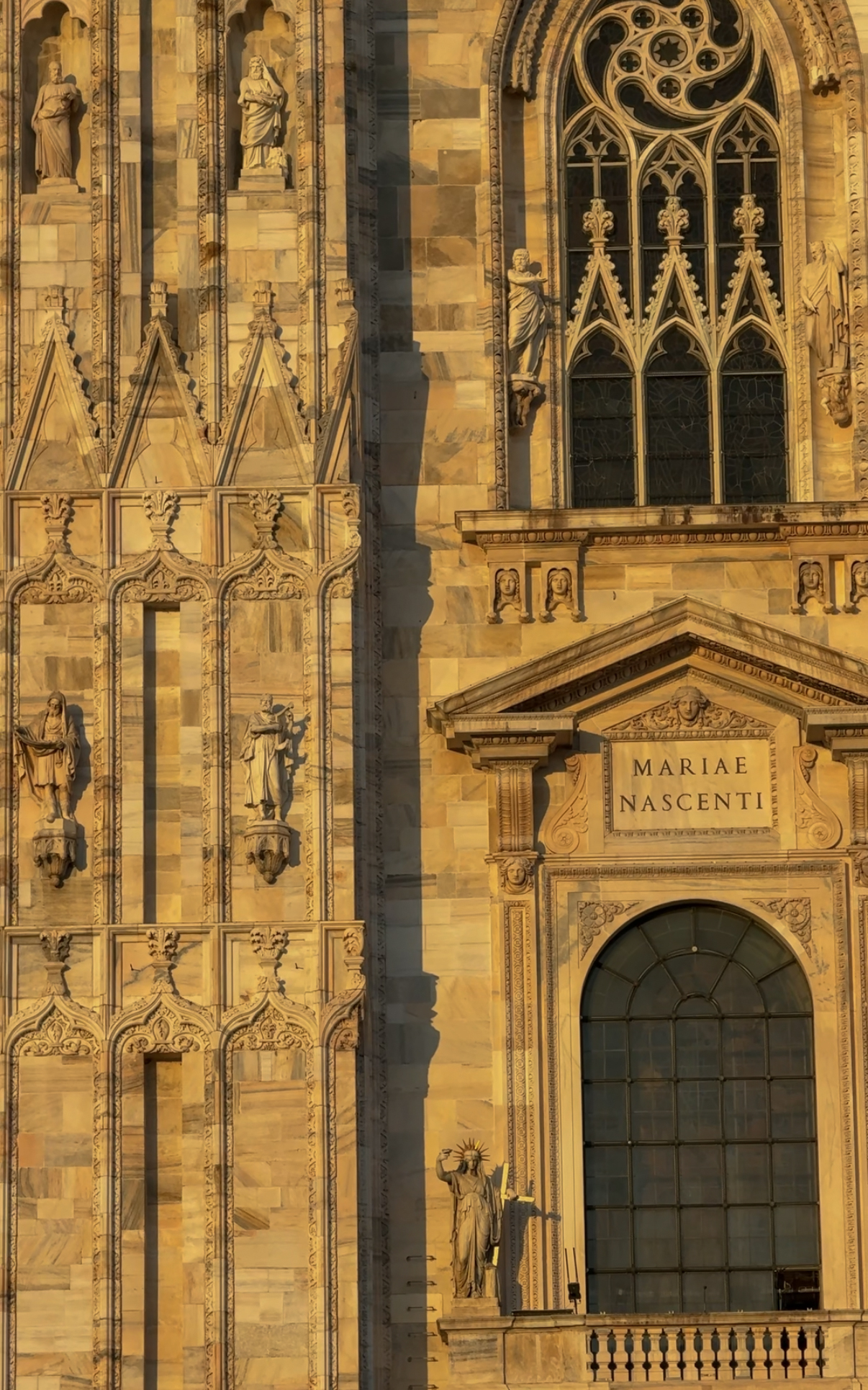 Duomo facade detail, MARIAE NASCENTI inscription, Milan