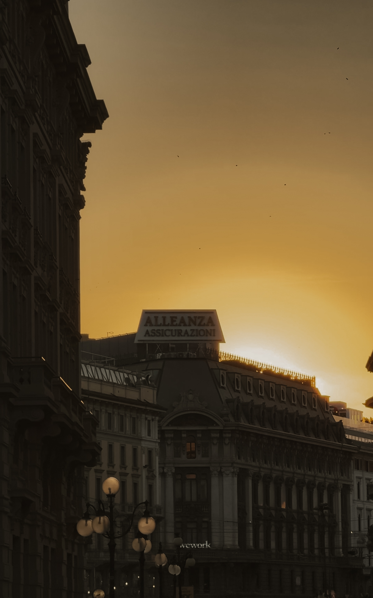 City buildings and street lamps at sunset, Milan