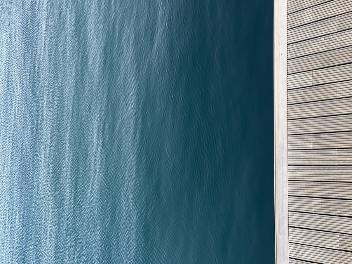 Blue water and wooden boardwalk, Doha Old Port