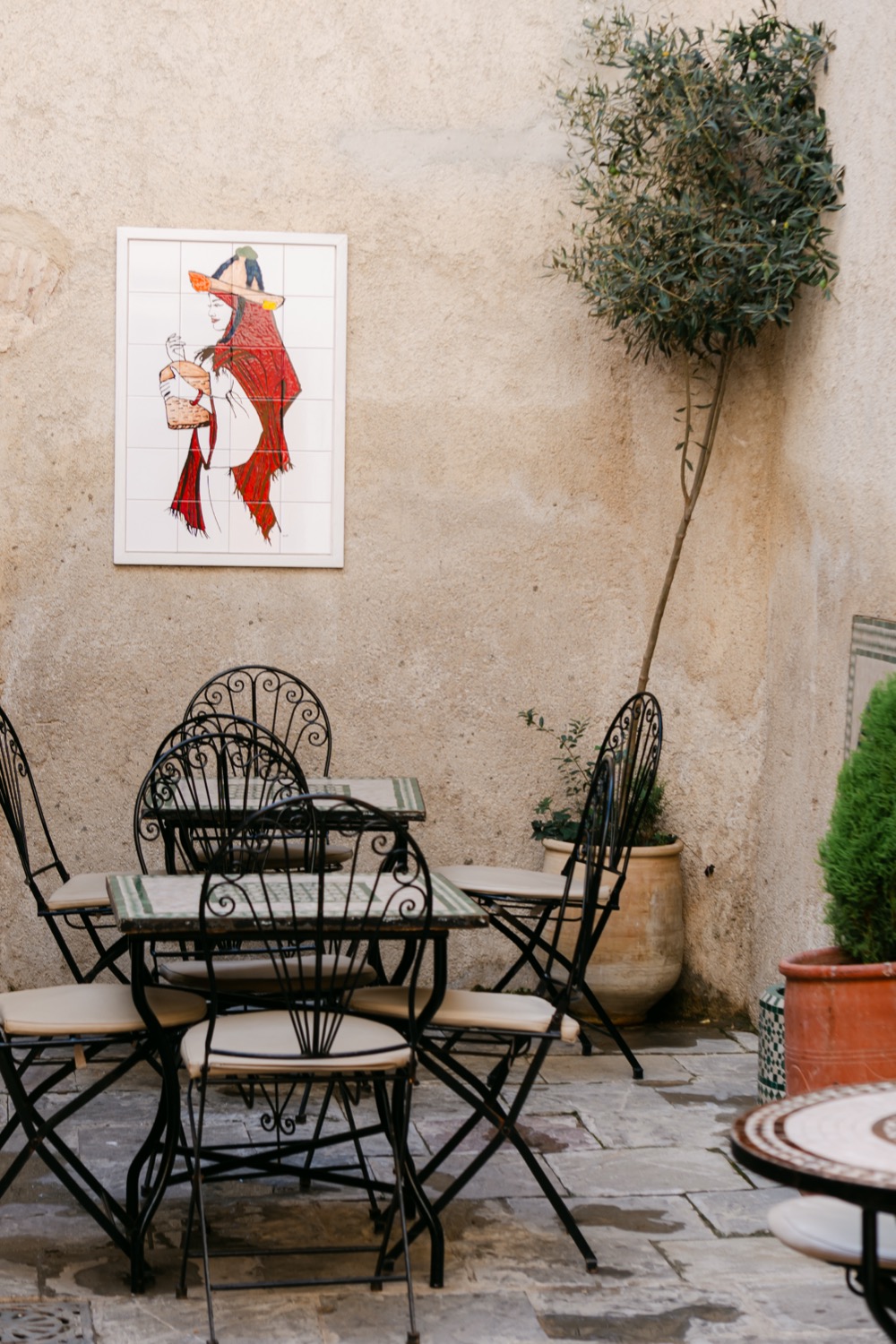 Iron chairs in a café courtyard, Tangier