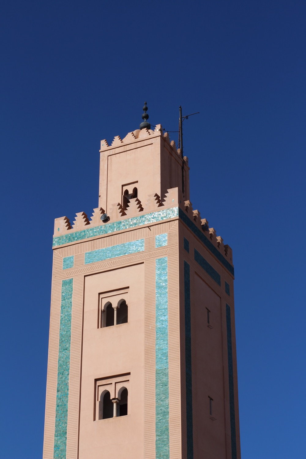 Islamic building facade seen from below against blue sky