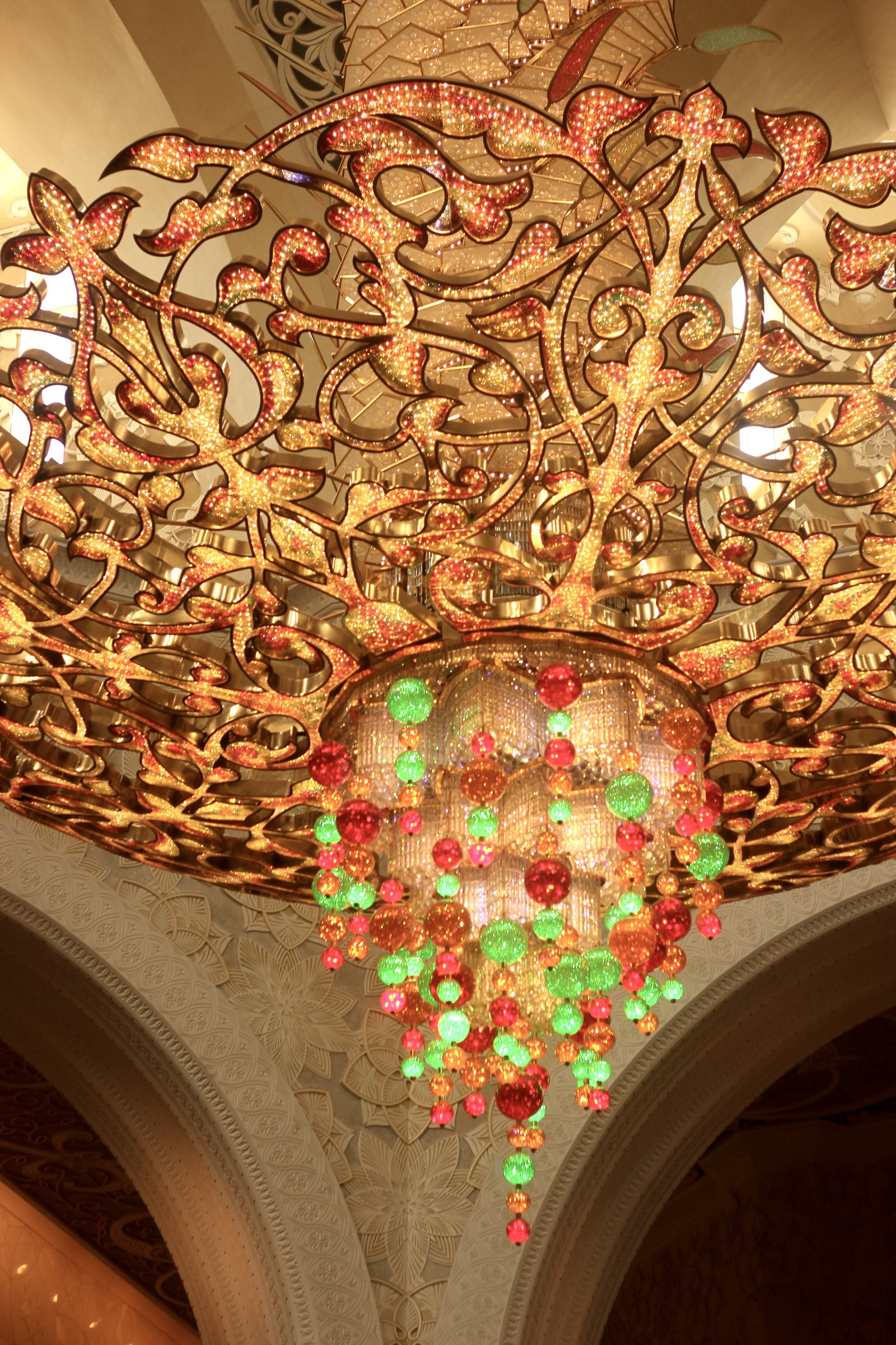 Carved and gilded ceiling detail with glass beads in green and red