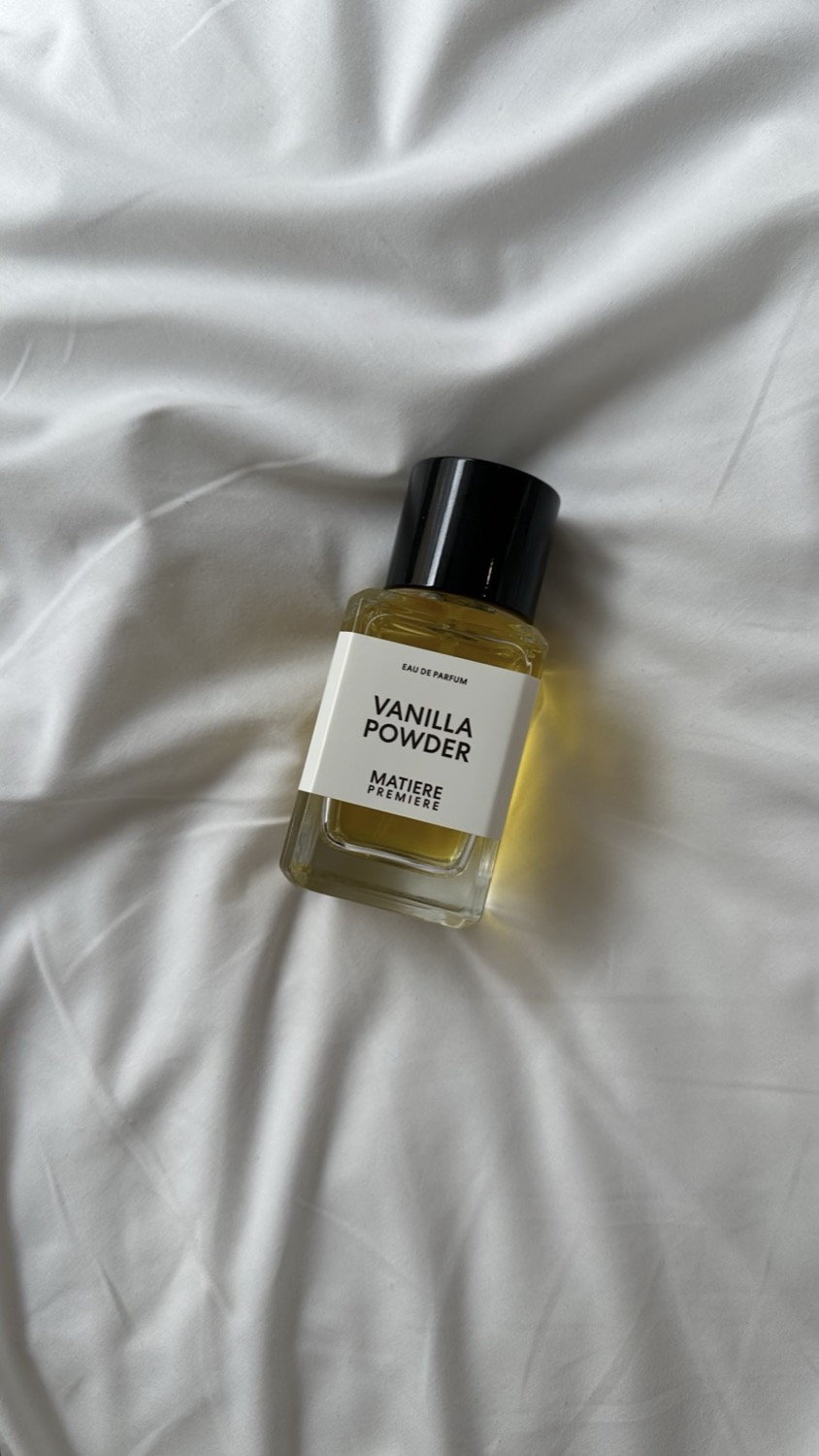 Matière Première perfume bottle on white sheets