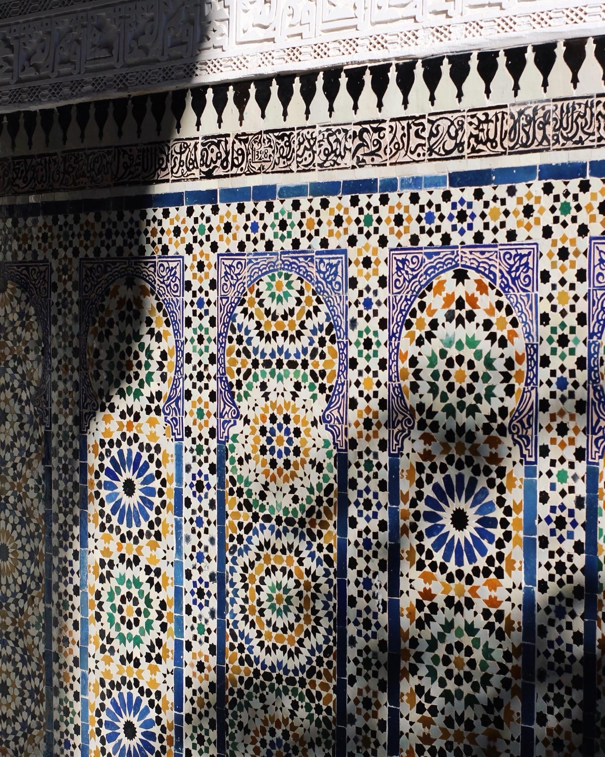 Moroccan zellige tilework with intricate geometric mosaic patterns