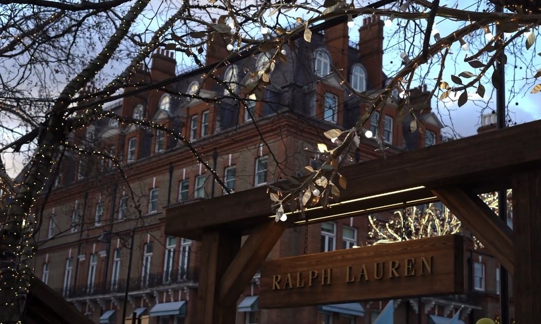 The Ralph Lauren sign held in branches strung with lights, building behind, London