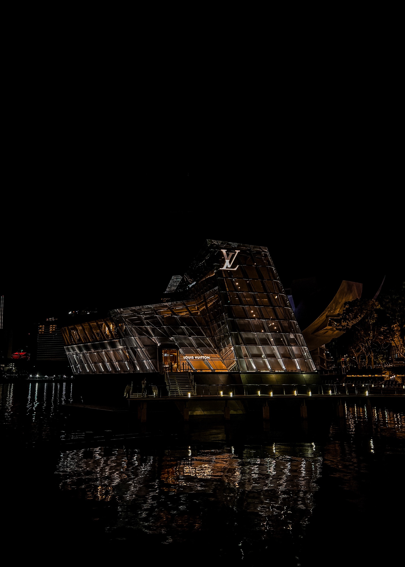 Louis Vuitton building on the water at night, Singapore