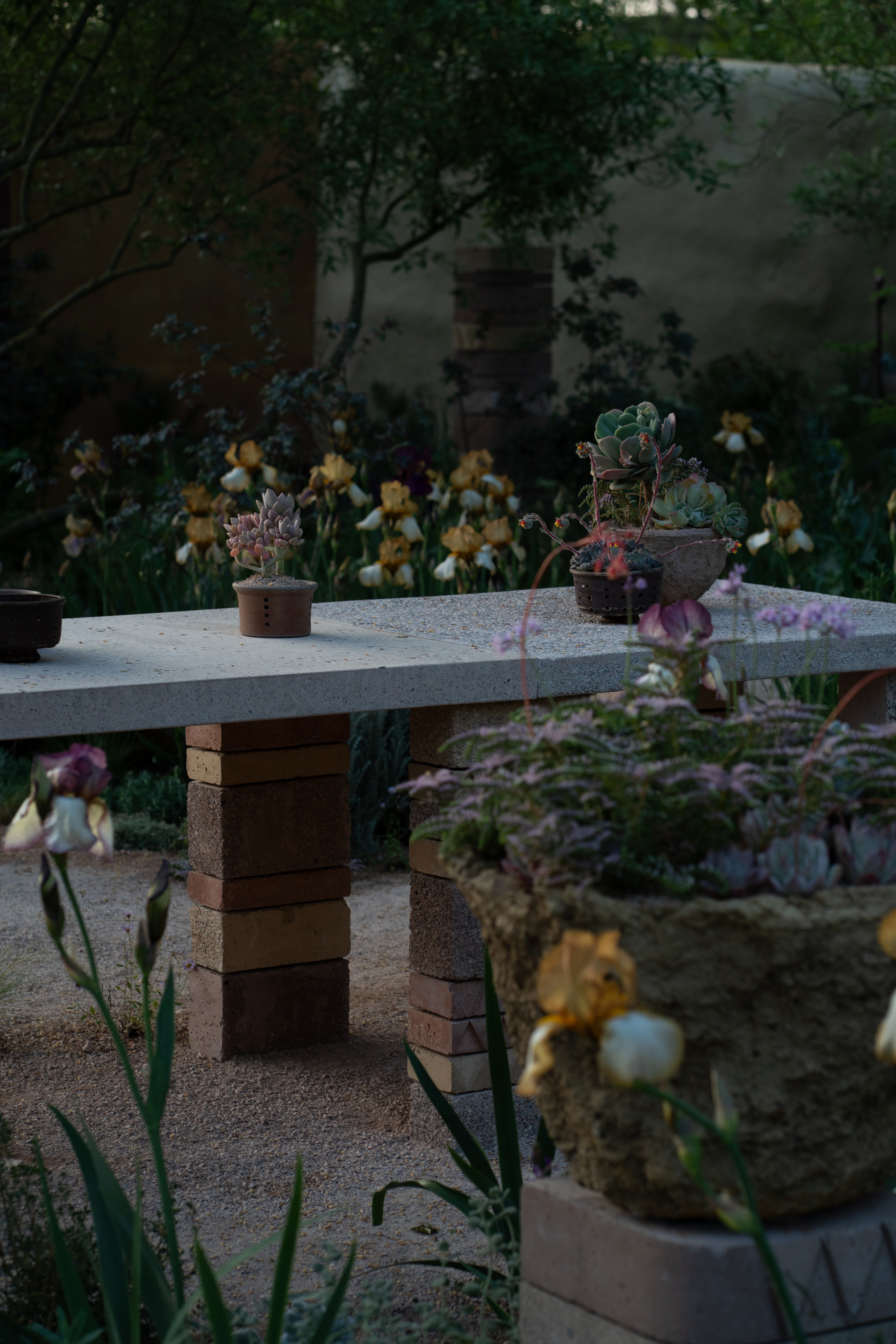 Stone, vessels and planting details seen from the edge of Sarah Price's RHS Chelsea garden.