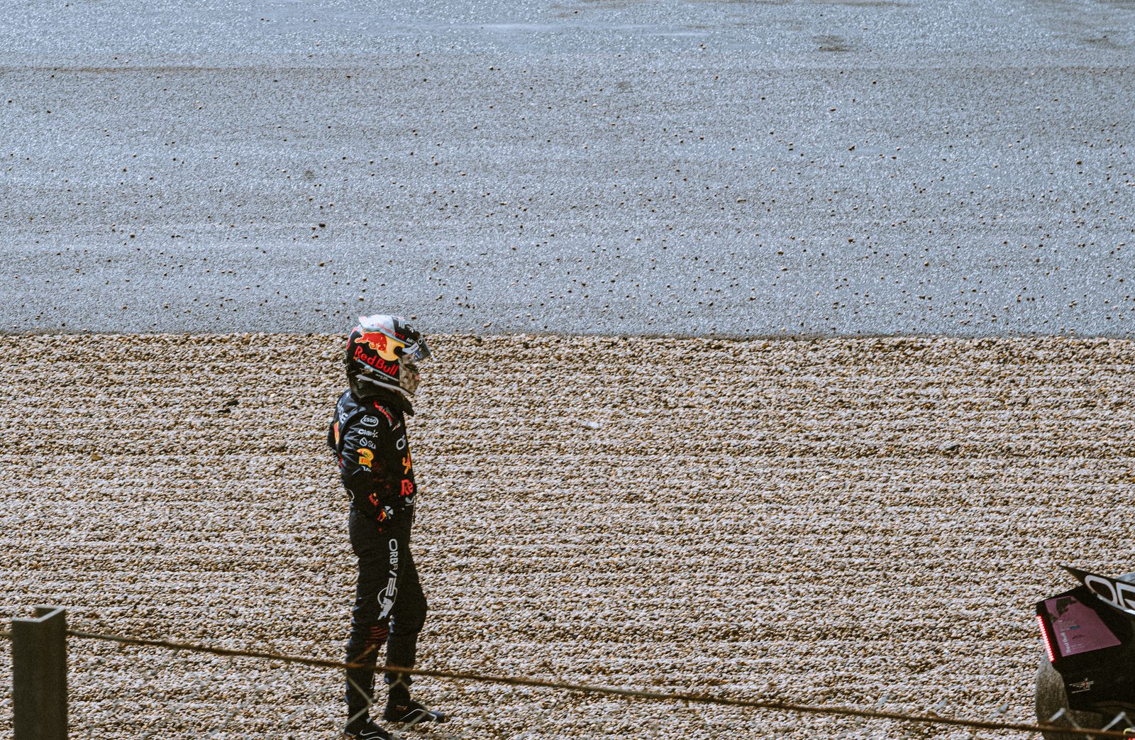 A driver alone beside the gravel