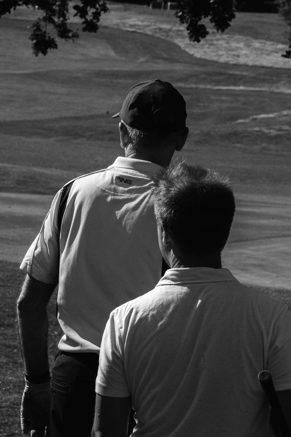 Two players walking the course together, in black and white, McLaren Construction Group Golf Day, Kent