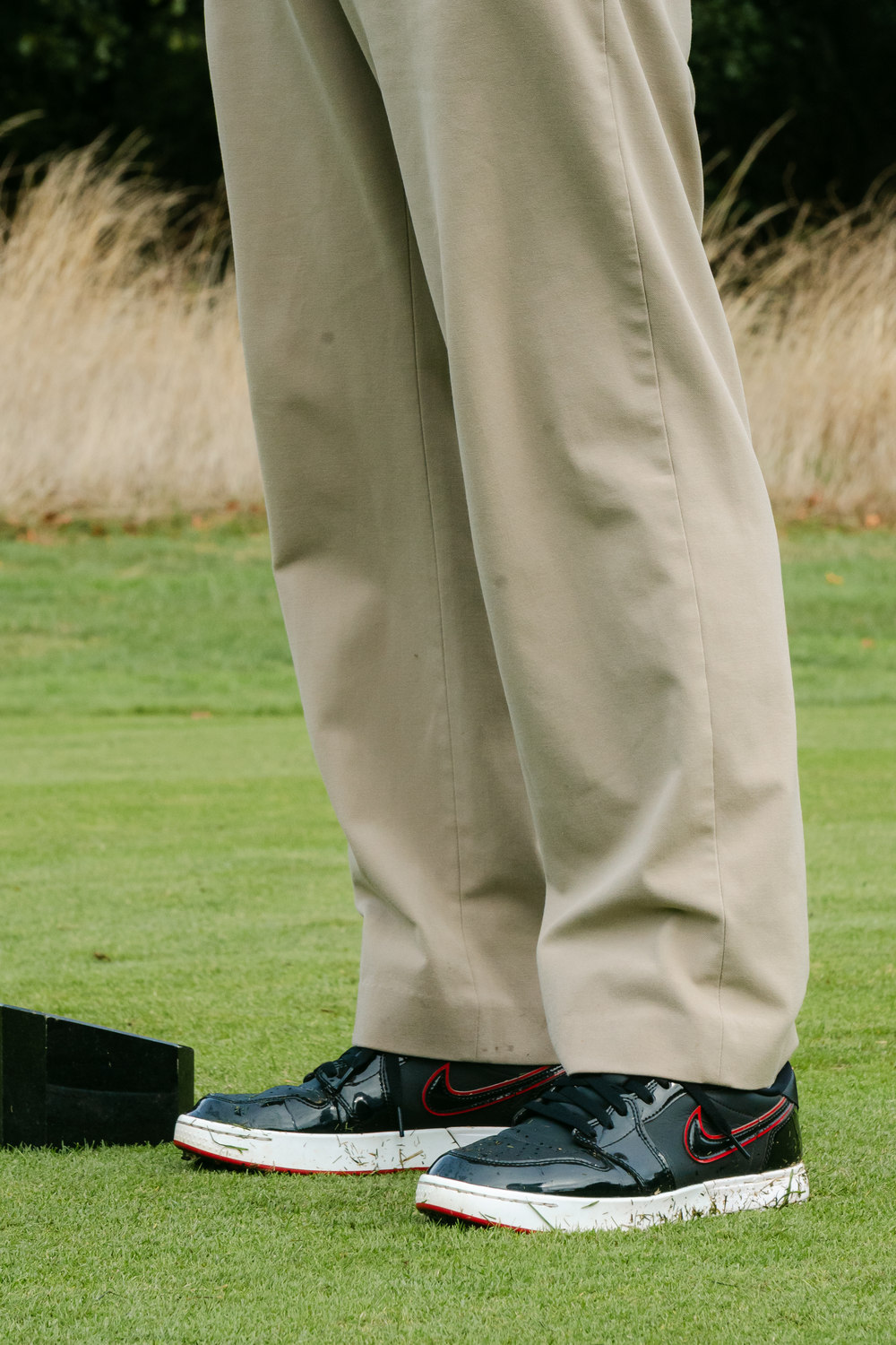 Trousers and shoes waiting beside the tee marker, McLaren Construction Group Golf Day, Kent