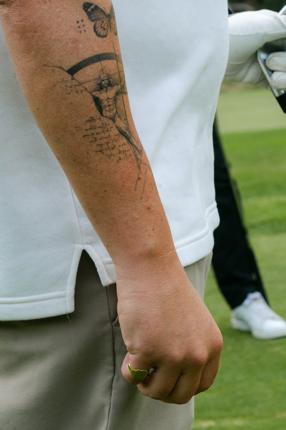 A gloved hand at rest beside a tattooed forearm, McLaren Construction Group Golf Day, Kent