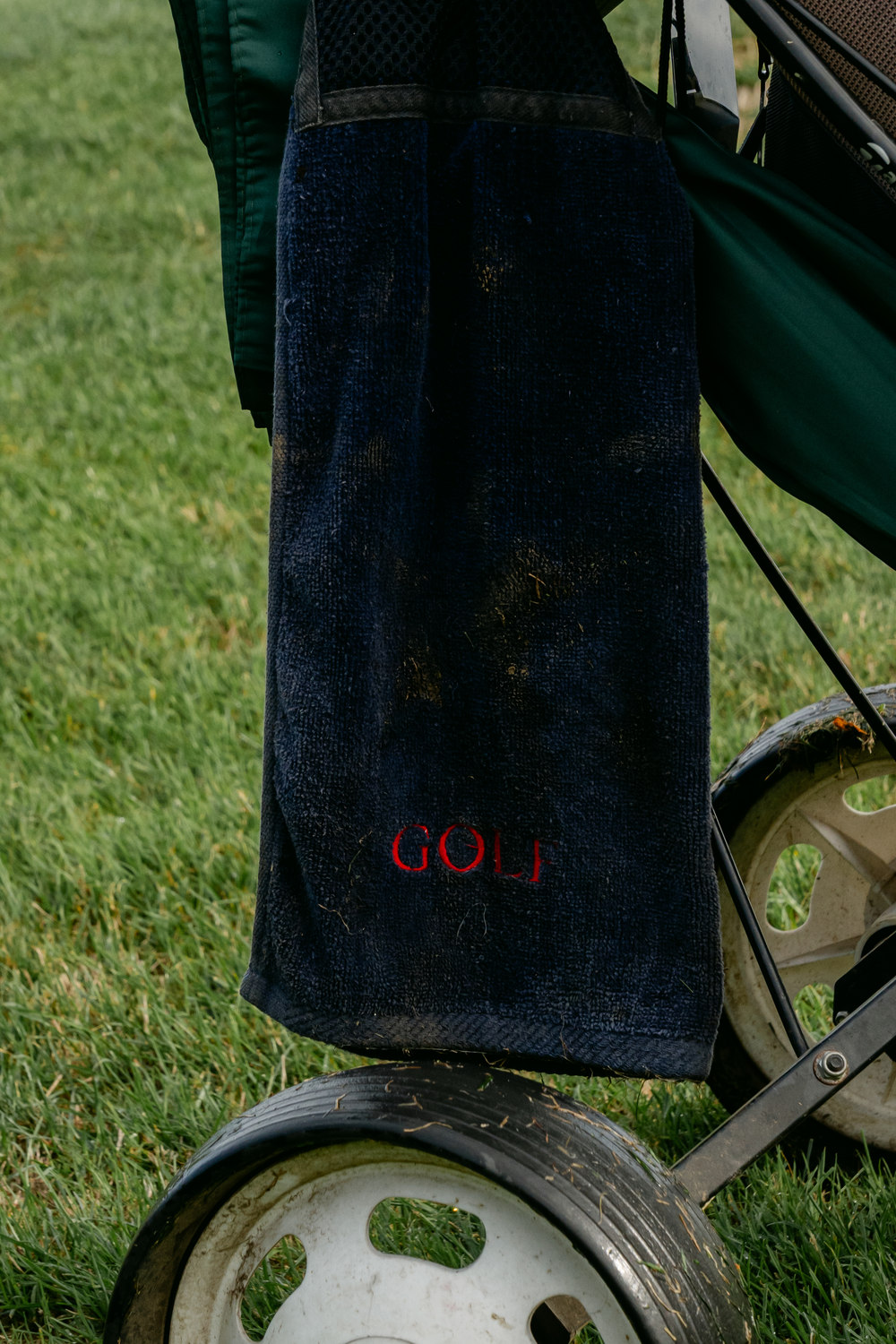 A towel hanging from the wheel of a trolley, McLaren Construction Group Golf Day, Kent