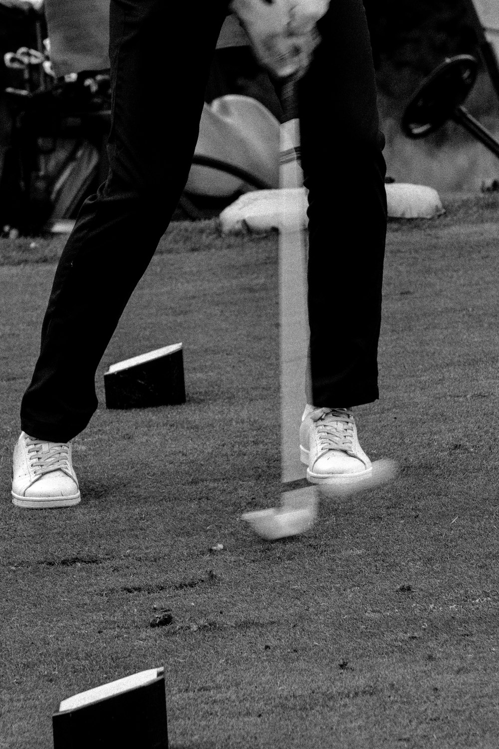 A tee and a pair of shoes on the ground, in black and white, McLaren Construction Group Golf Day, Kent