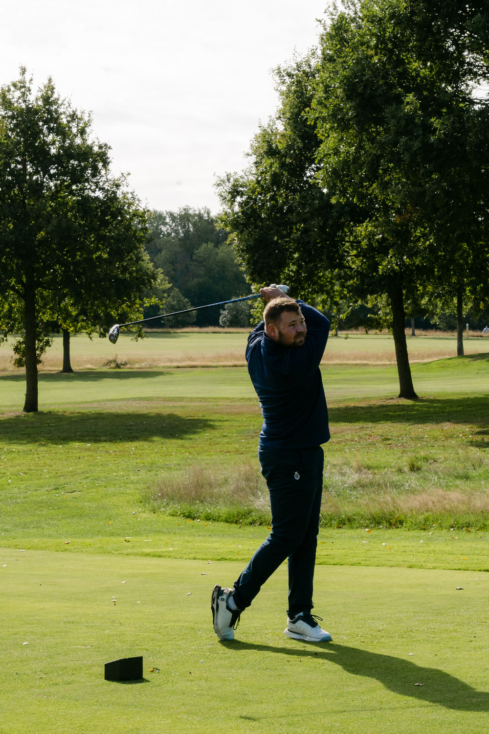 A distant figure on the tee, framed between oaks, Rochester & Cobham Park, Kent