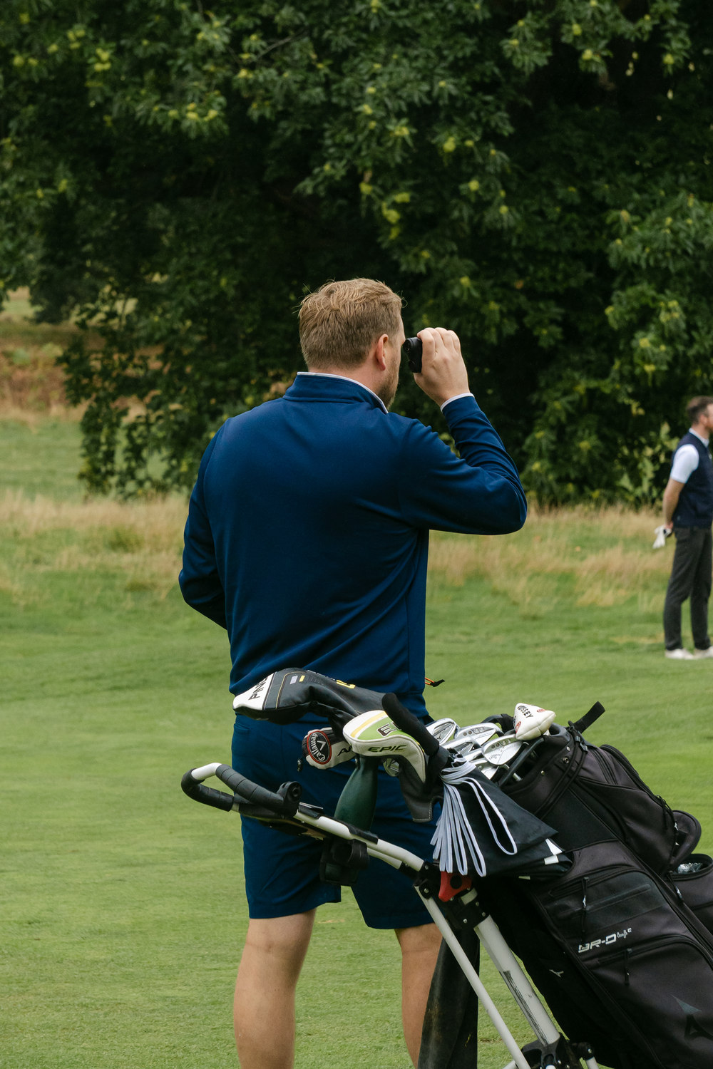 A player photographing the round on his phone, McLaren Construction Group Golf Day, Kent