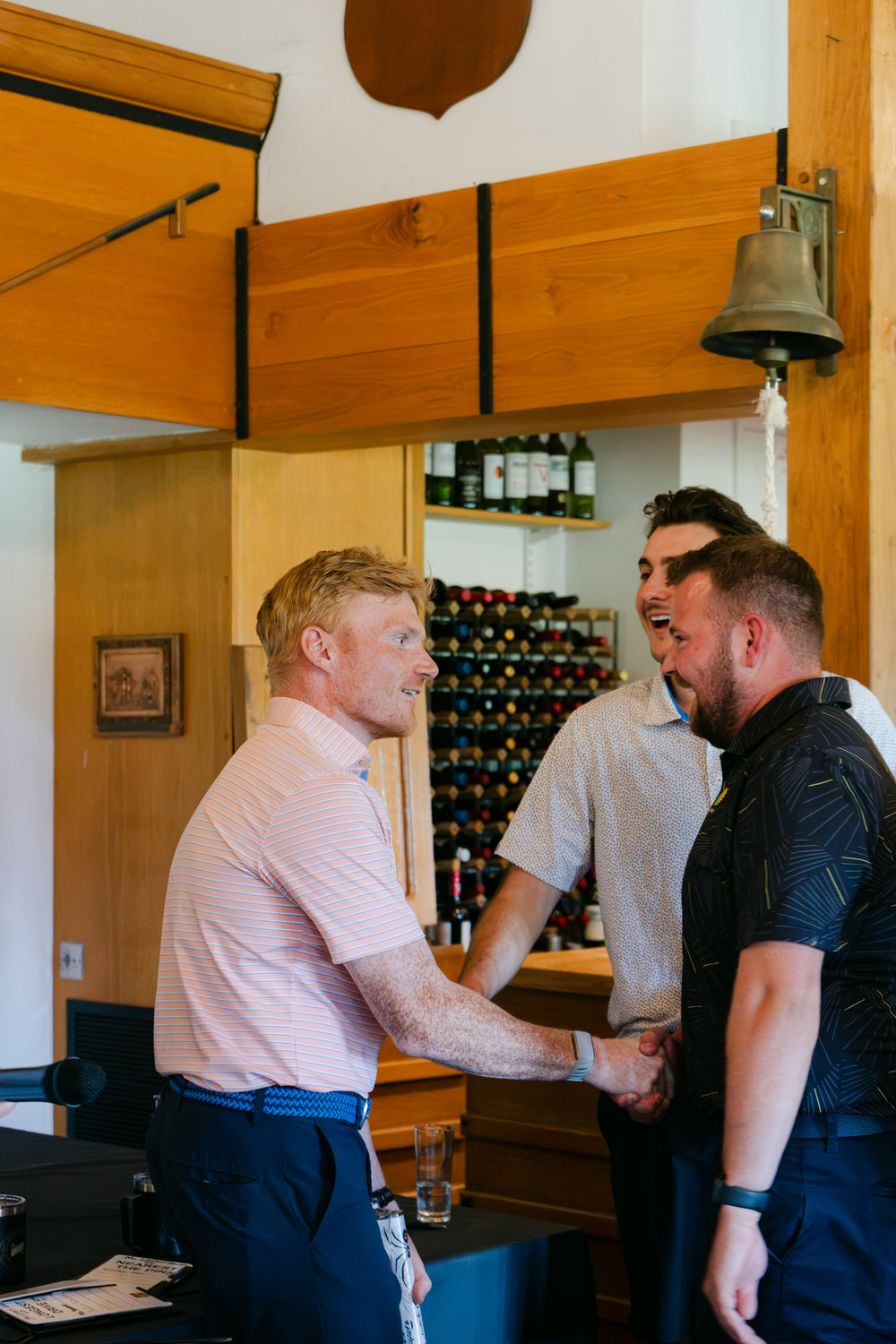 A handshake in the clubhouse at the end of the day, Rochester & Cobham Park, Kent