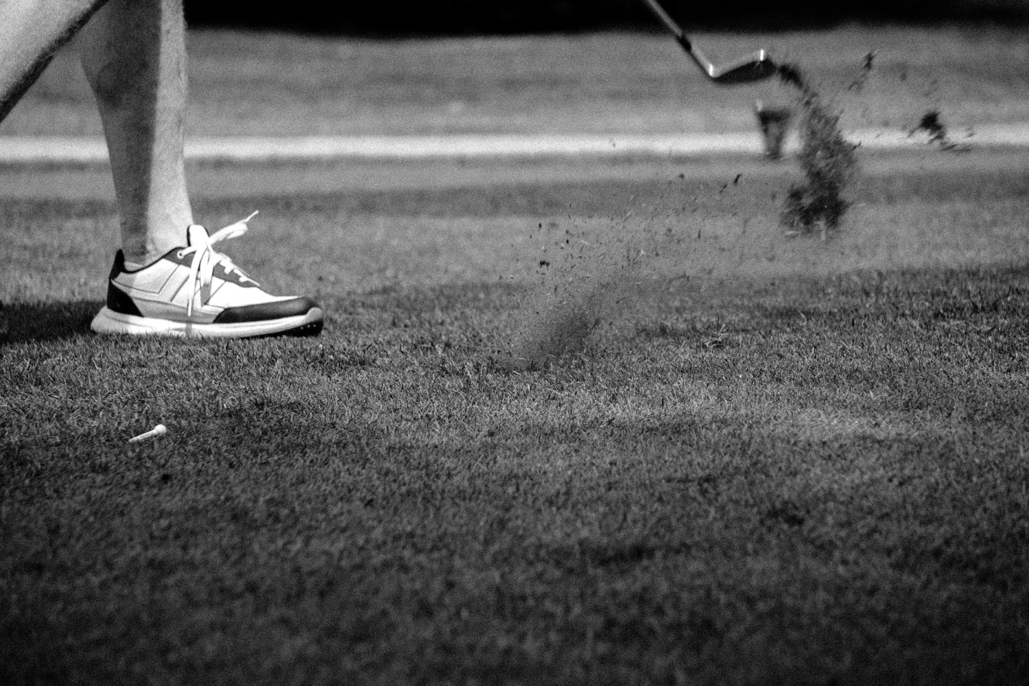 A divot rising from the turf as a shot is played, Magnolia Classic, Horsforth Golf Club, Leeds